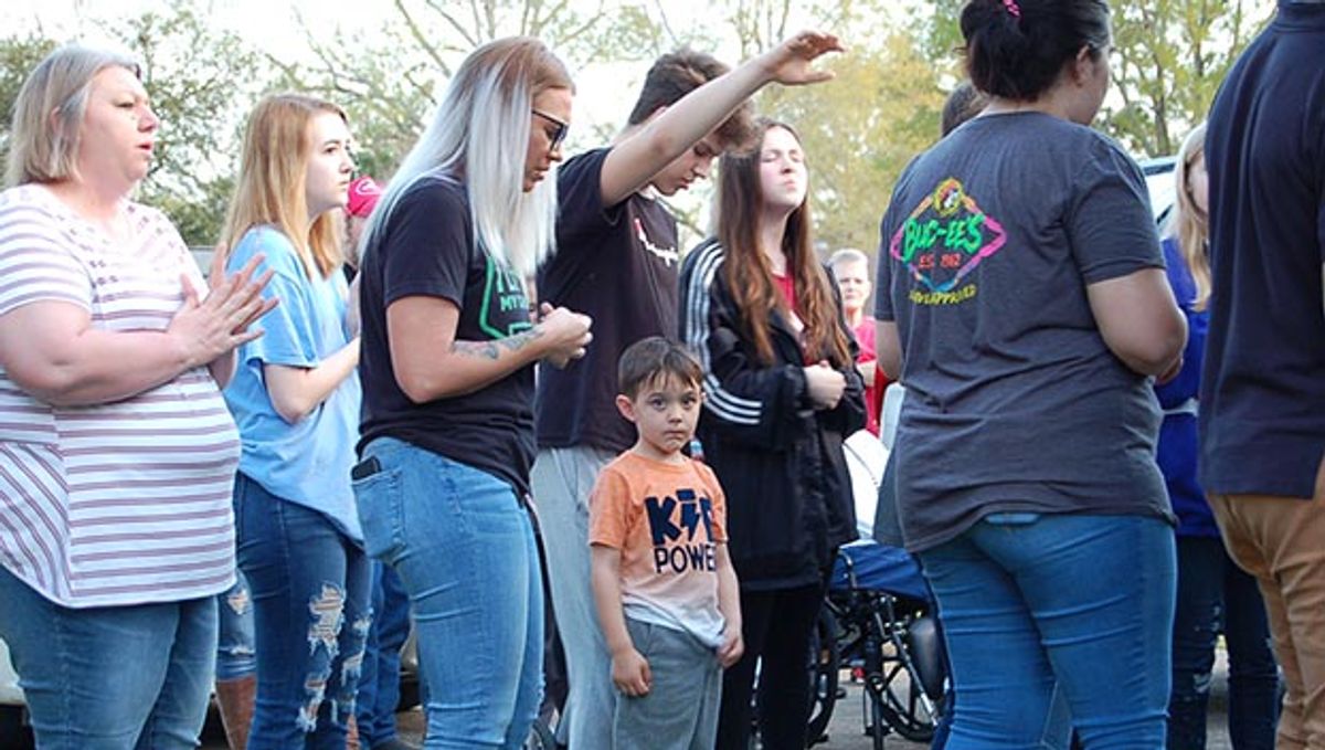 Community rallies around family at vigil as baby recovers from near dr...