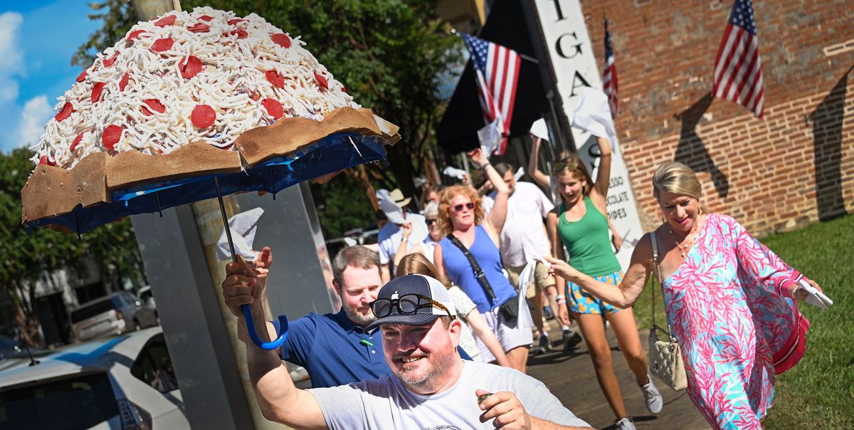 Dancing through Downtown: Second-line with pizza vibes connects back-to-back celebrations of new downtown businesses