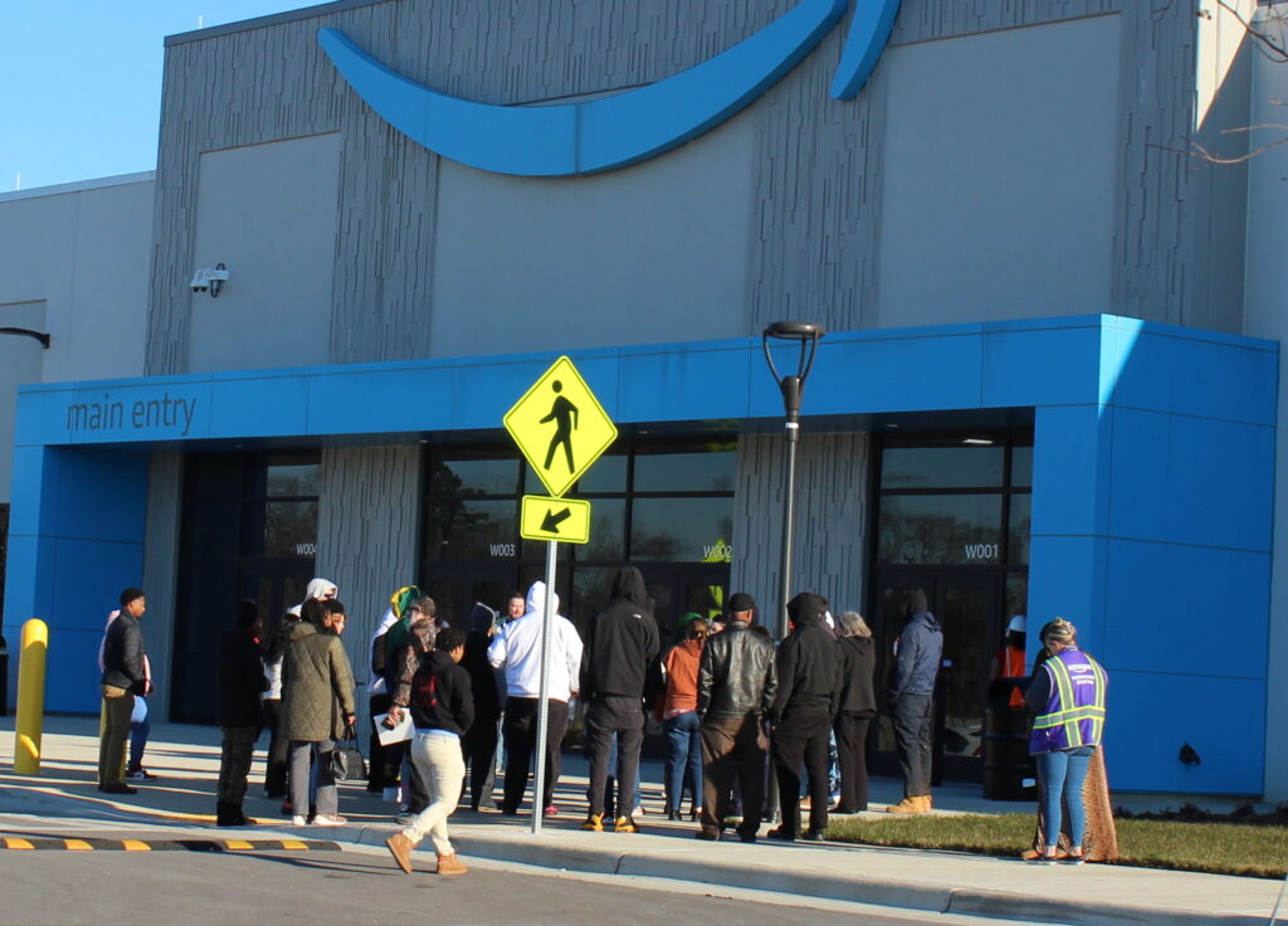 People hoping to work for Amazon gather for a hiring event on Saturday. The company had canceled the event, but not everyone got the word. McKenzie Miller | Johnstonian news