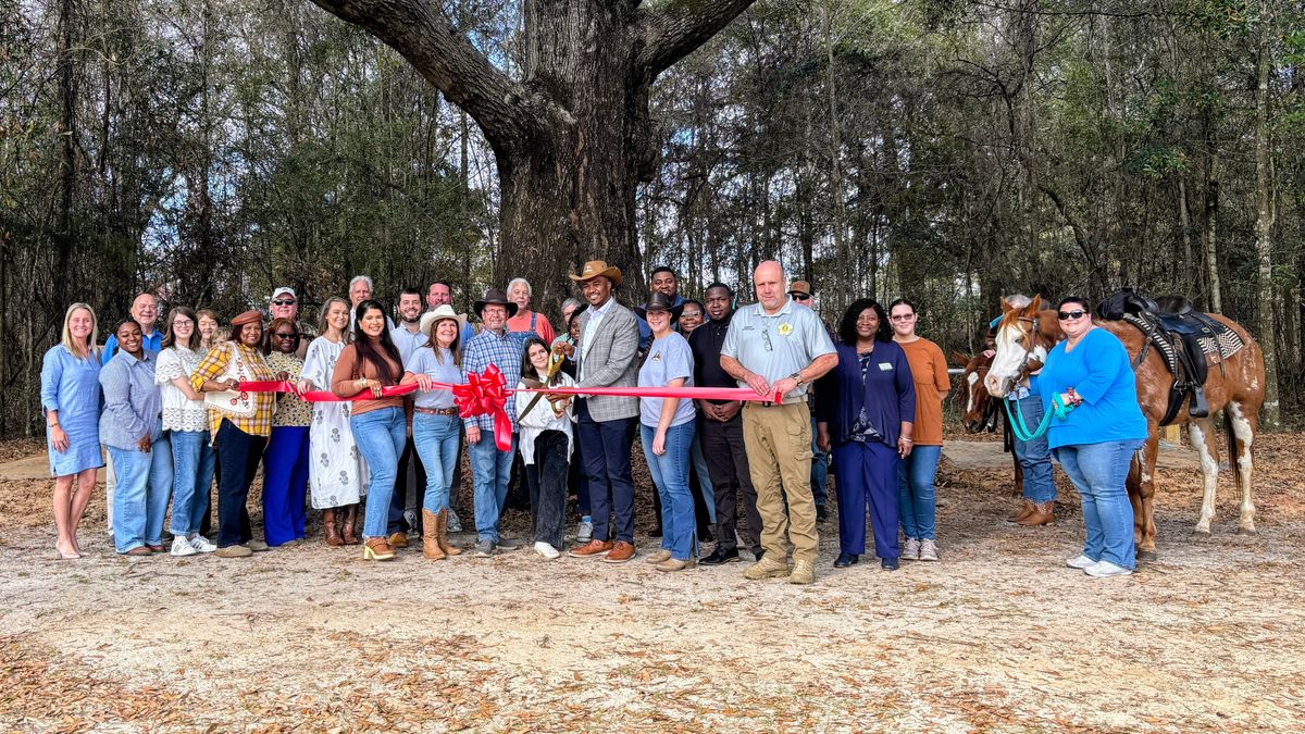 Spudys Ribbun Ribbon cutting marks Saddles & Spurs opening