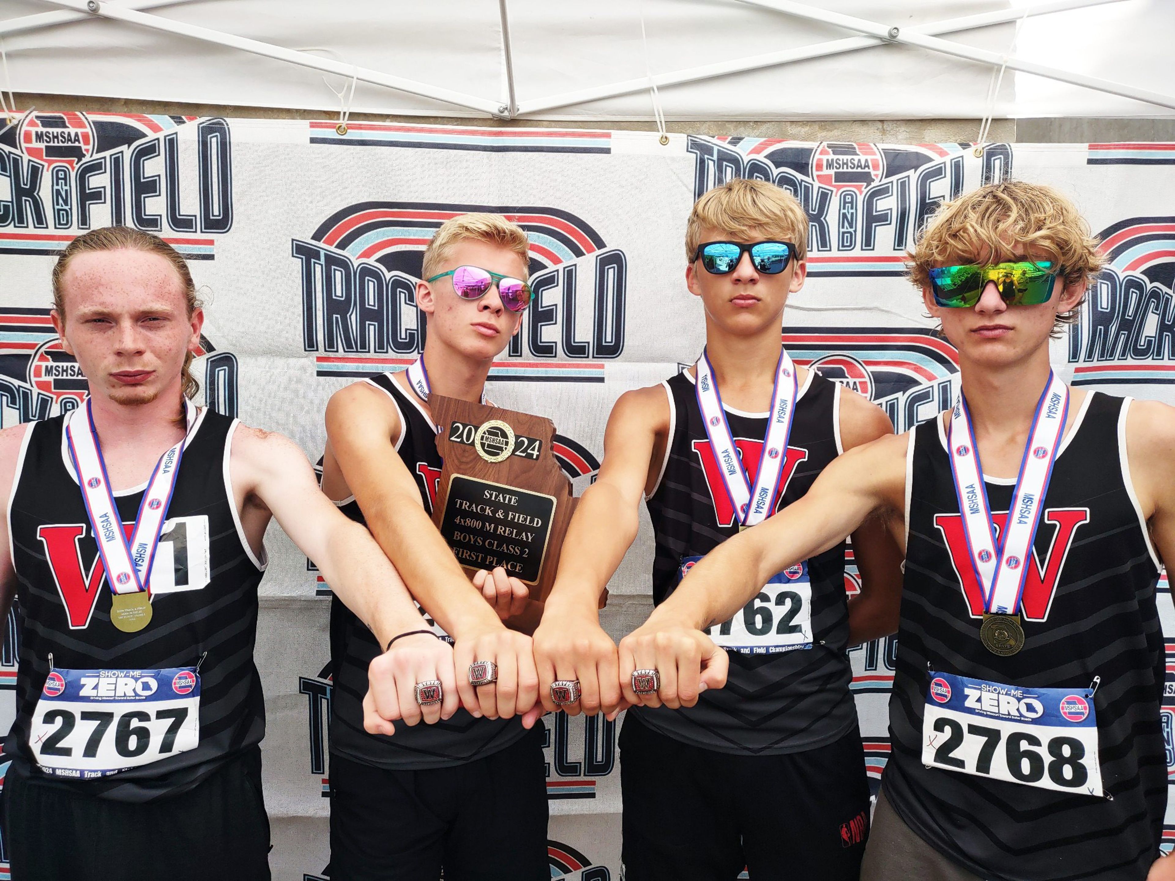 Merlin Tucker (from left), Reed Layton, Calvin Layton and Hayden VanGennip, members of the winning 4x800 relay, are also part of the state champion cross country team.
