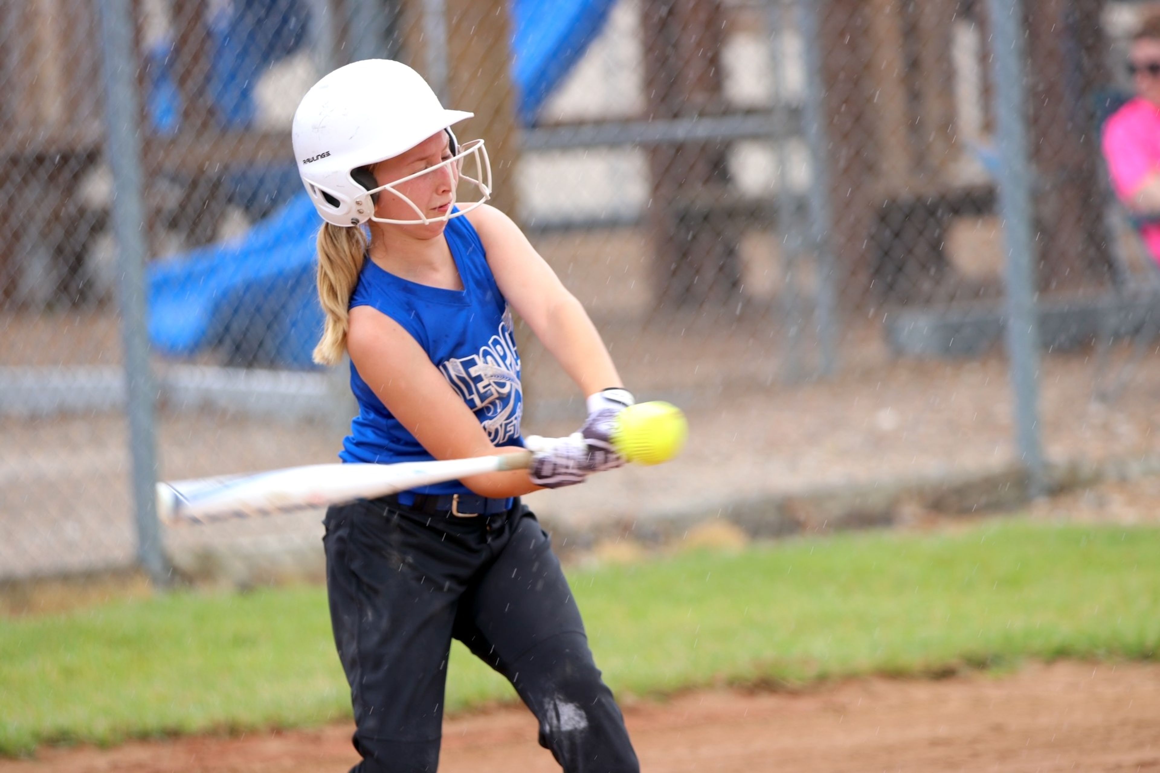 
Nellie Langston gets a solid base hit during her softball game against Marble Hill.
