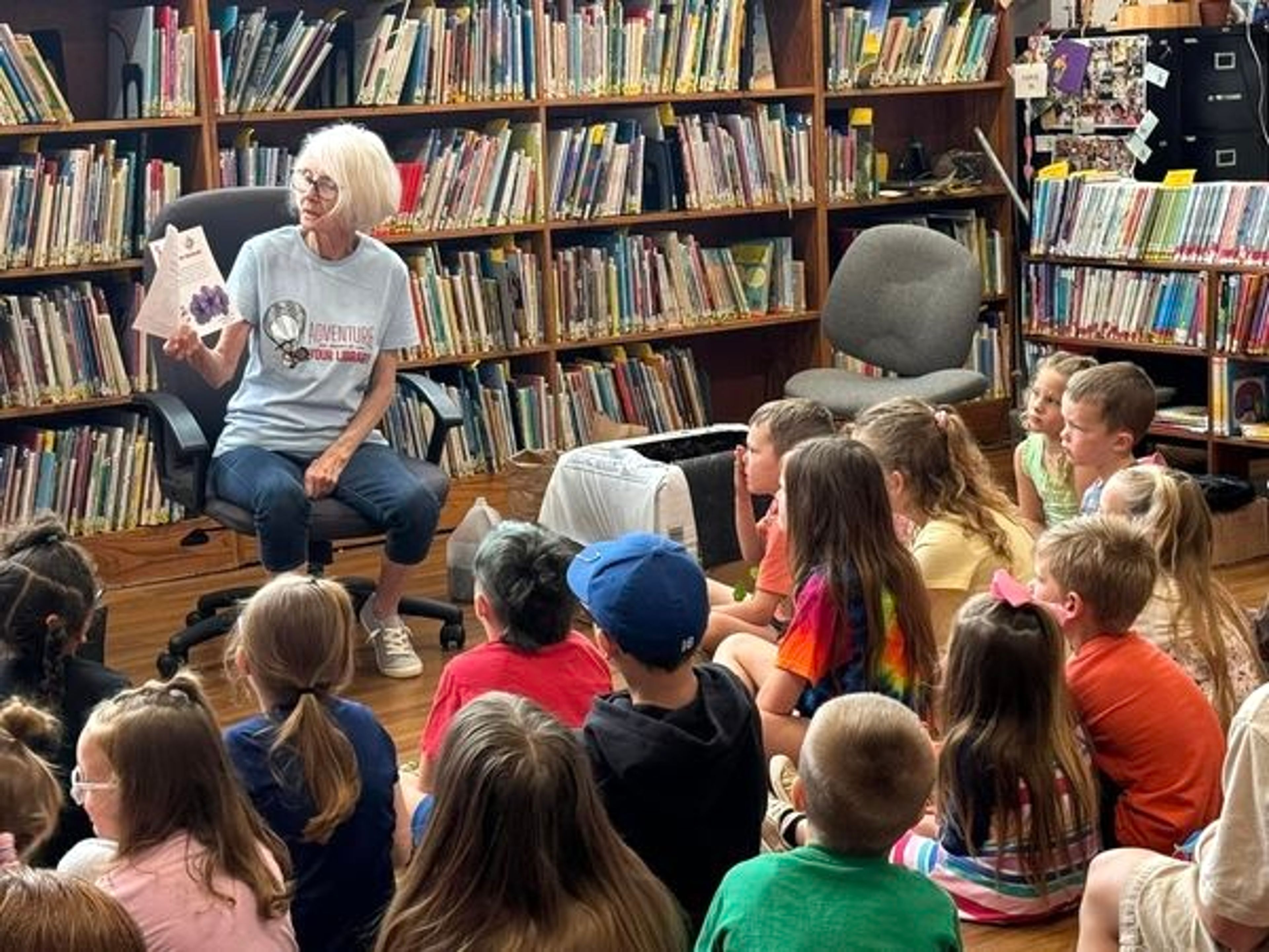 Patti Barrett reads to an attentive audience. Bollinger County Library's summer reading program meets every Wednesday through the end of July.
