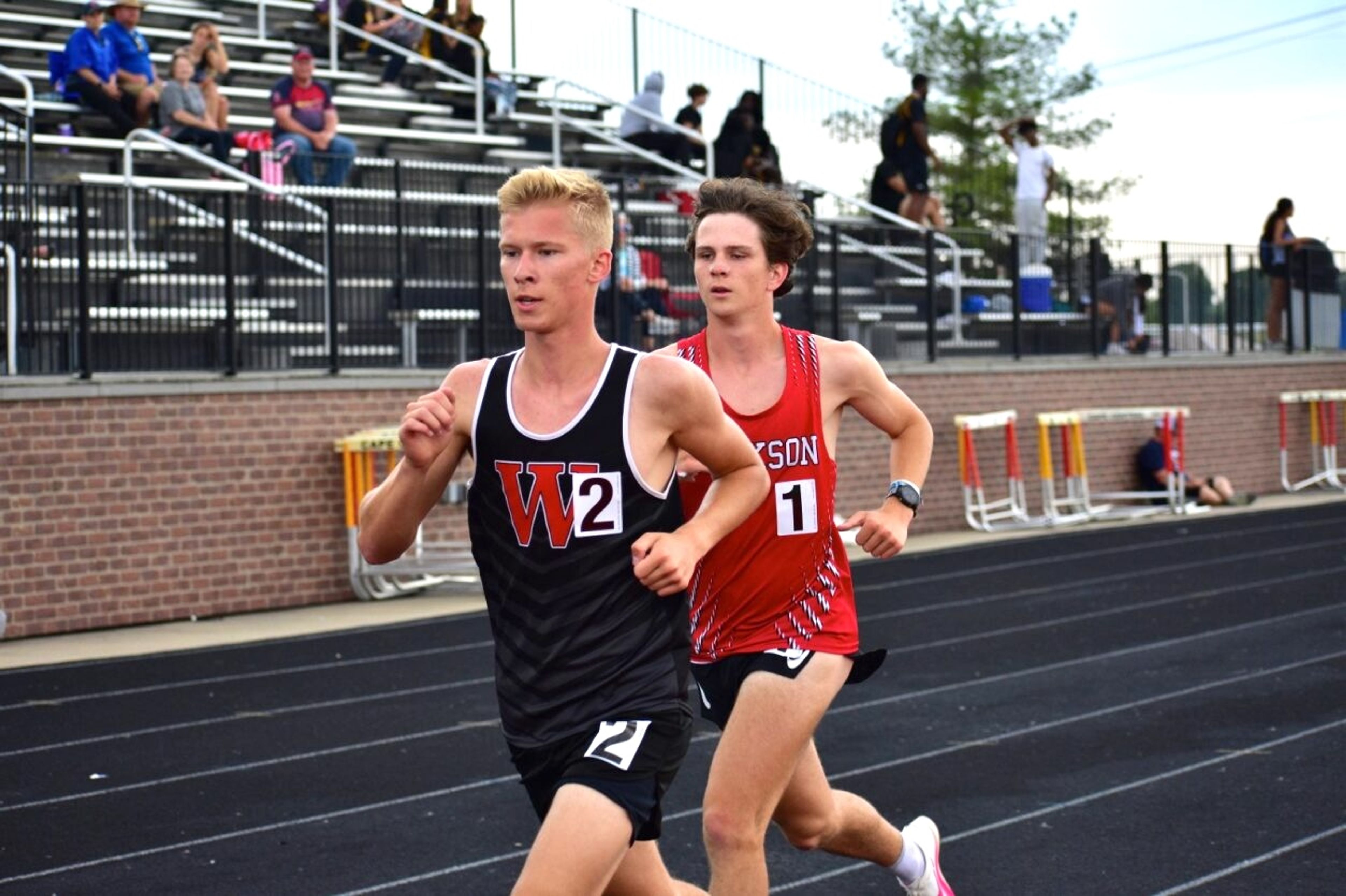 
Woodland's Reed Layton, a Semoball Awards finalist, and Jackson's Bryce Gentry race in the 3,200-meter event at the SEMO Conference championship meet April 27 at Cape Central High School.
