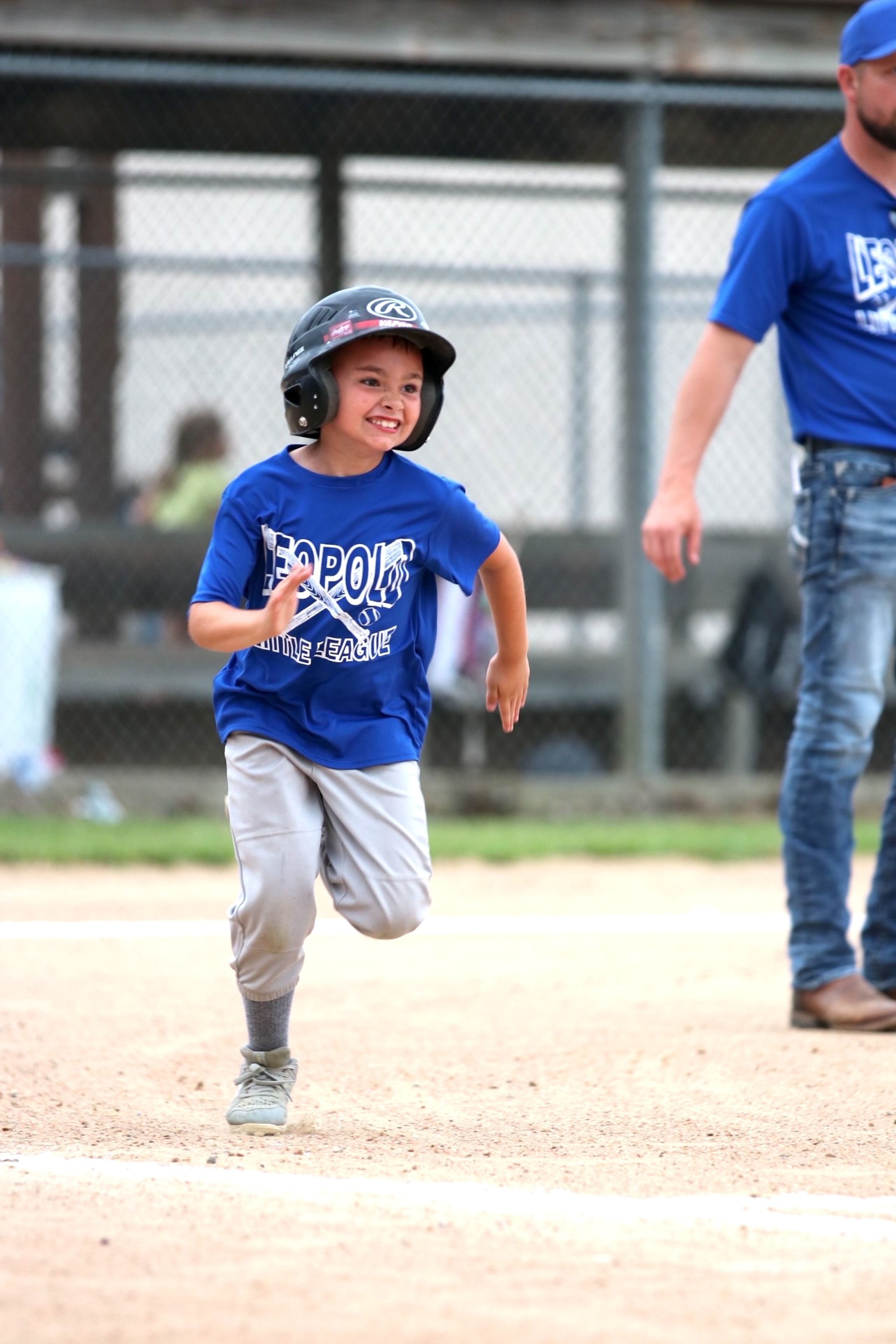 
Cam Hutchings runs quickly to first, attempting to avoid a force out during the 8U baseball game.