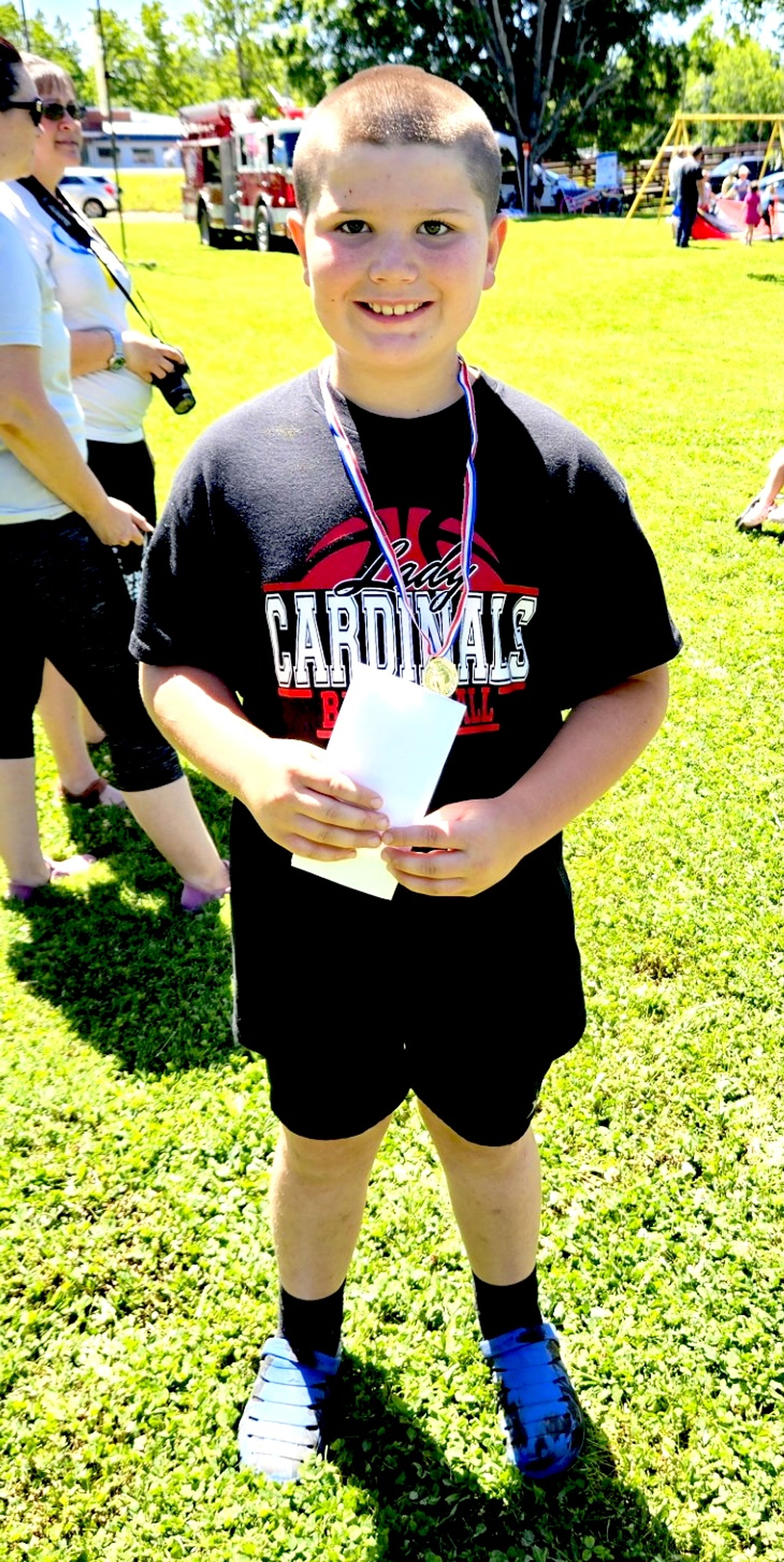 Talon Kinder is the first-place winner in the egg relay race for his age division (6 to 12).