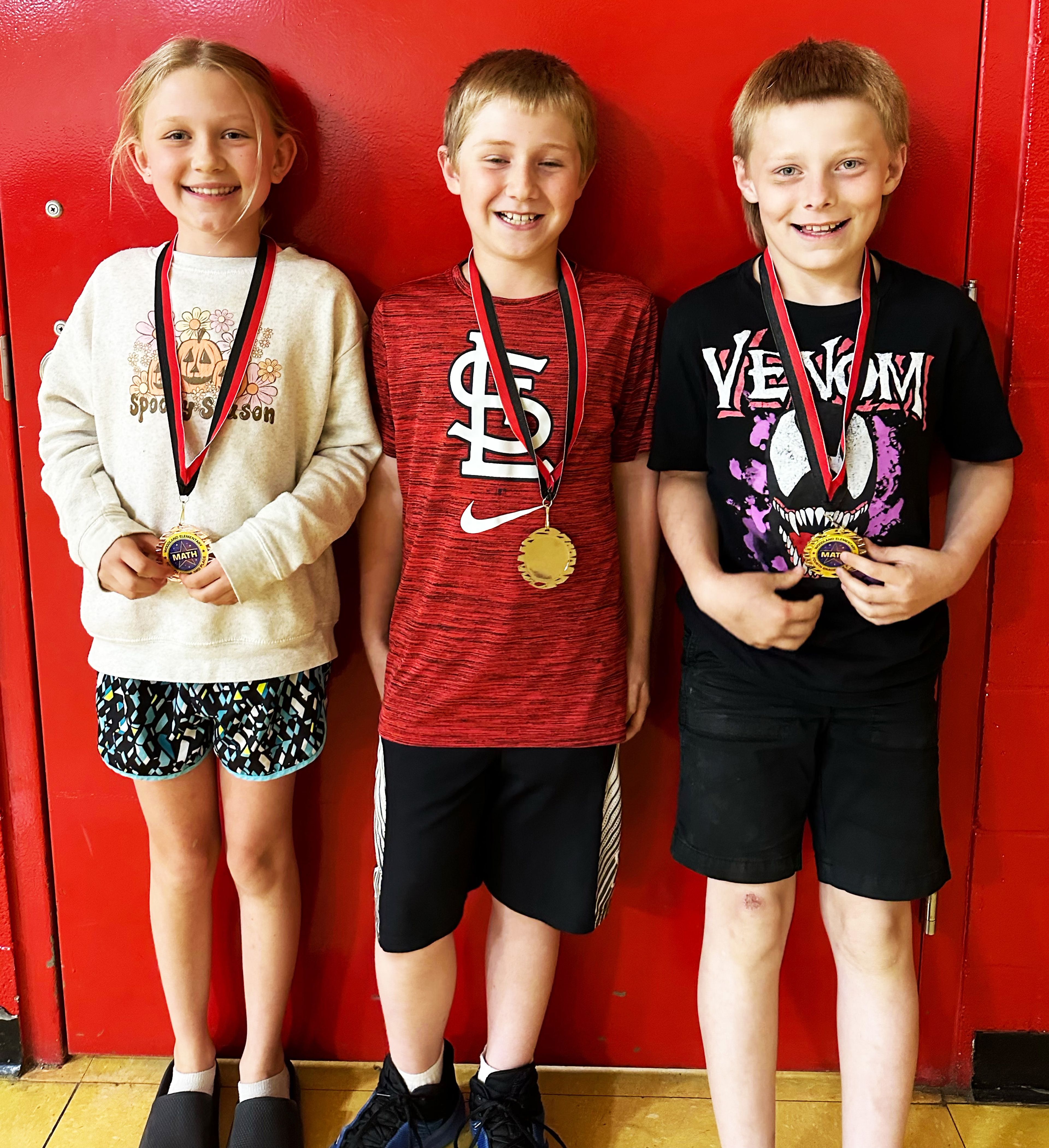 Fourth-grade winners (from left) include Violet Stegeman, third place; Zeke Upchurch, second place; and Bryson Overman, first place