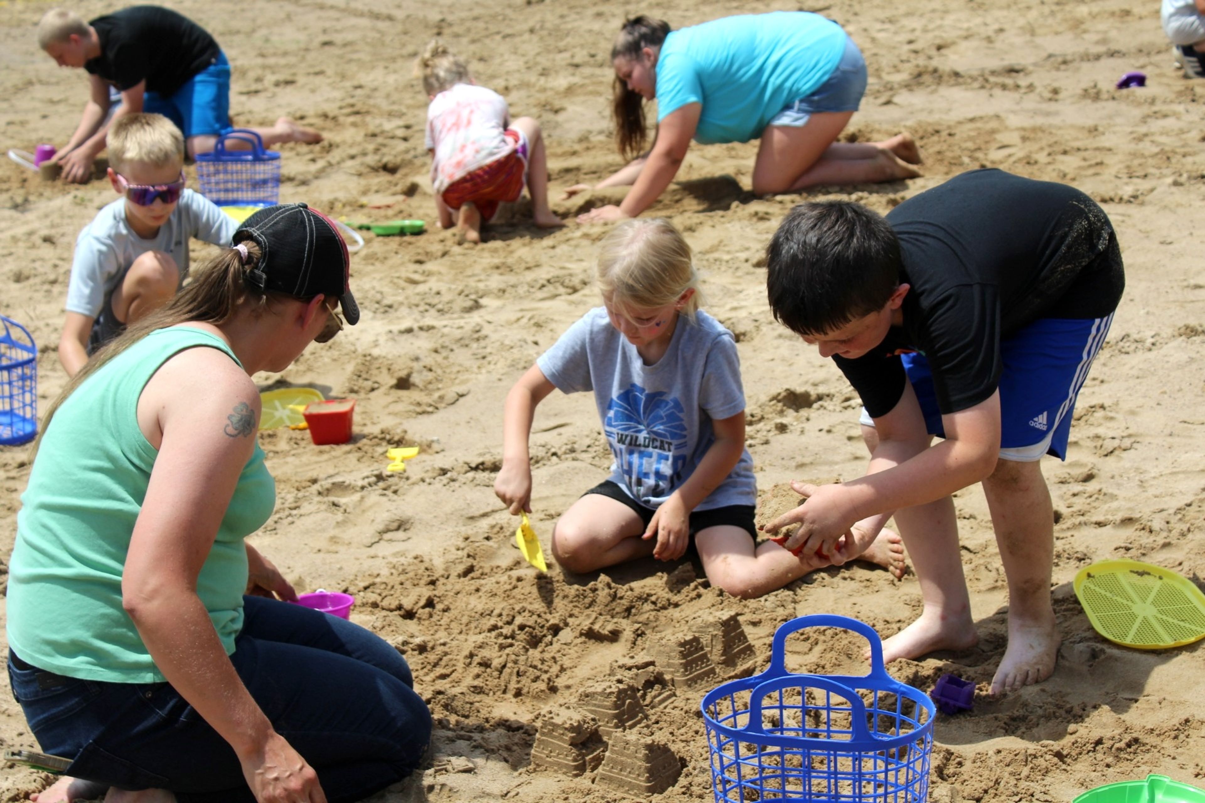 
Sarah McWilliams competes in the sand castle building competition with kids Aubrey and Leland.