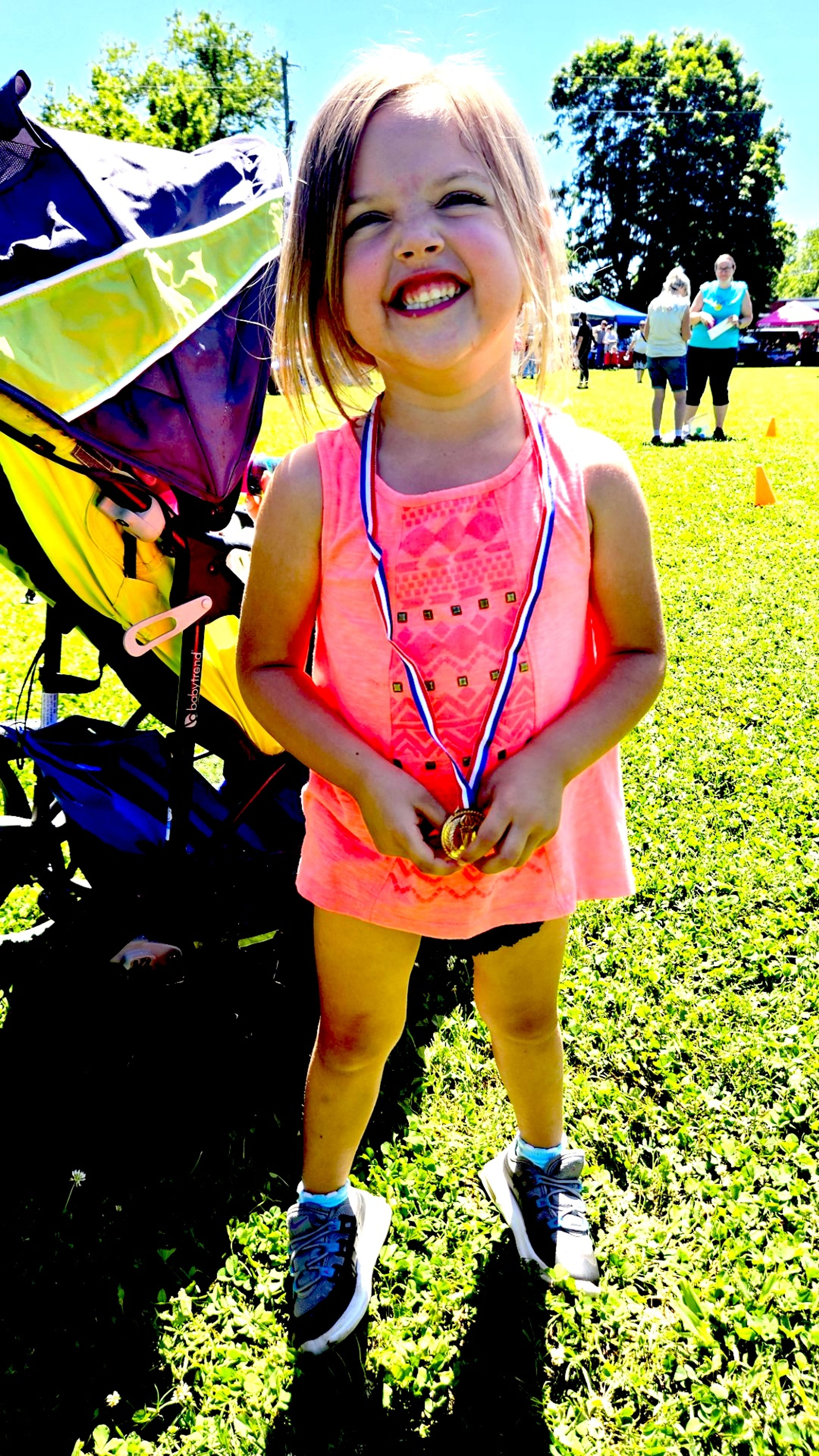 Arabella McWilliams is the first-place winner in the egg relay race for her age division (2 to 5).