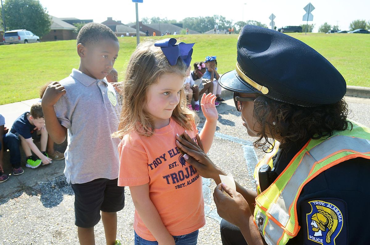 COMMUNITY HELPERS: TES students learn from