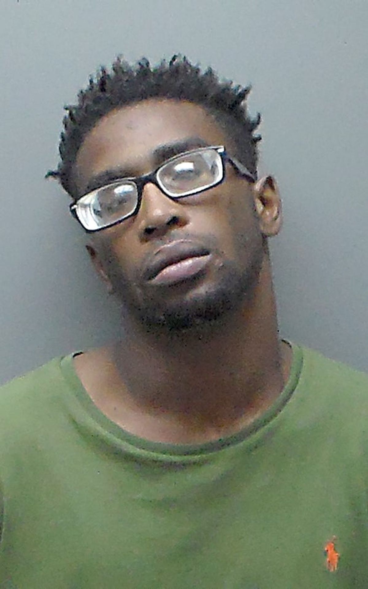 Troy man charged with shooting into occupied vehicle