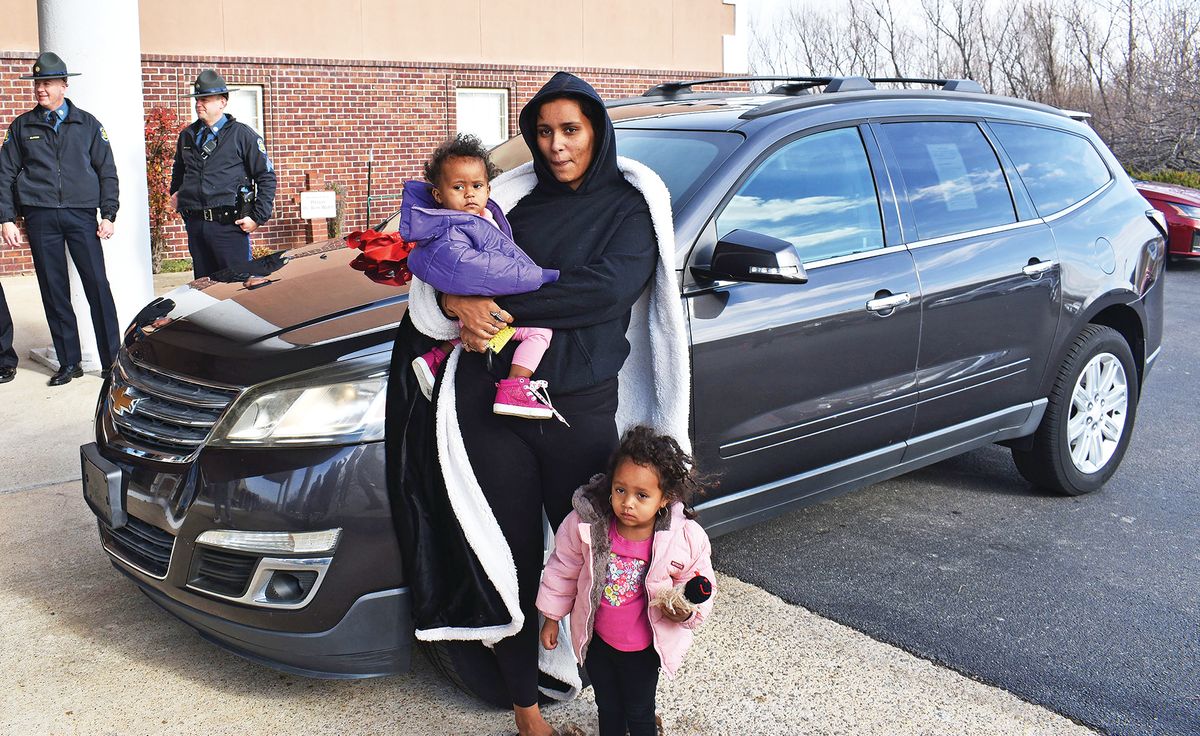 Single mom walking to church surprised with free car at Mount Calvary Christmas coat drive