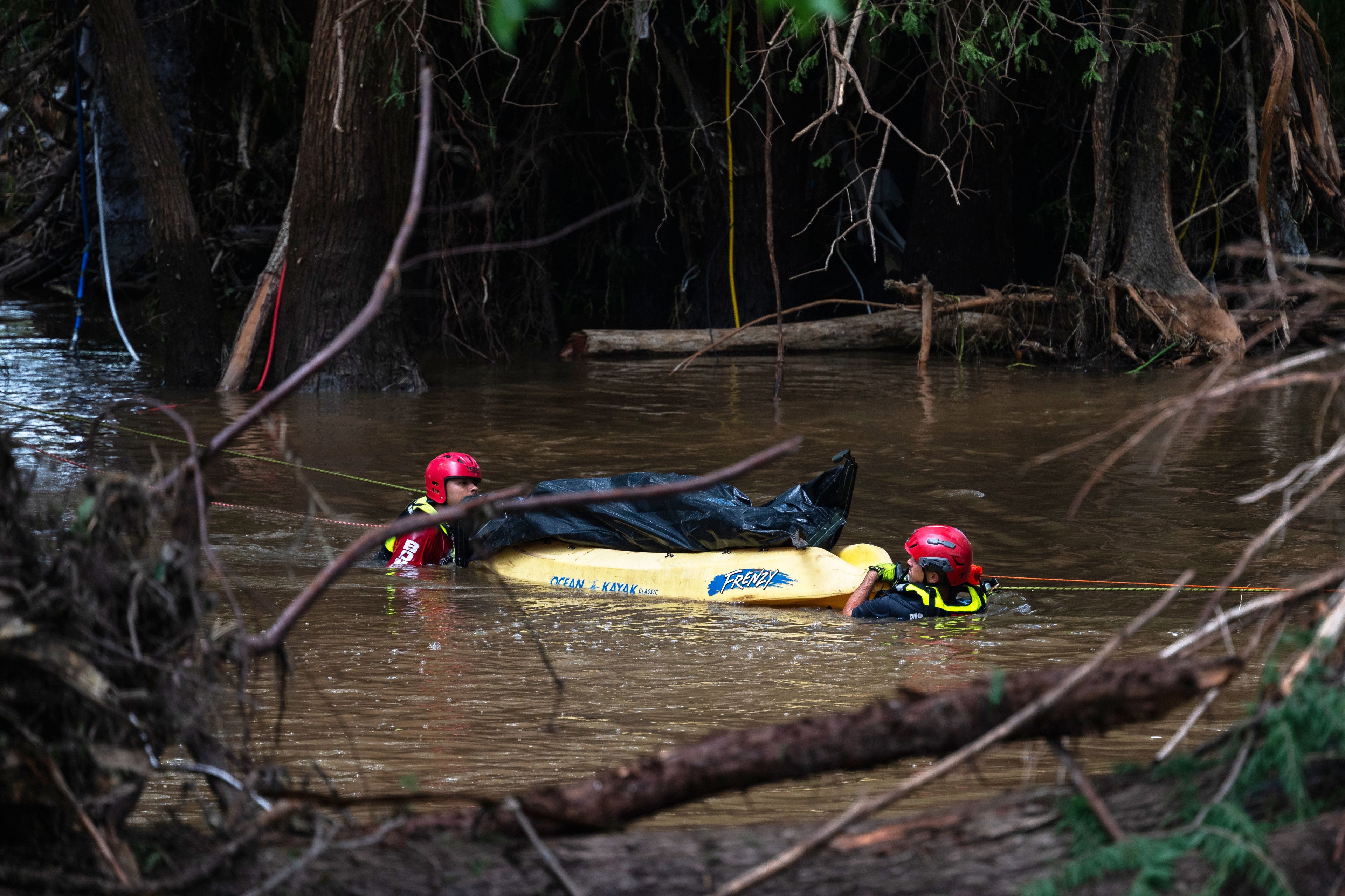 Photos of search crews racing against time as Texas flood deaths near ...