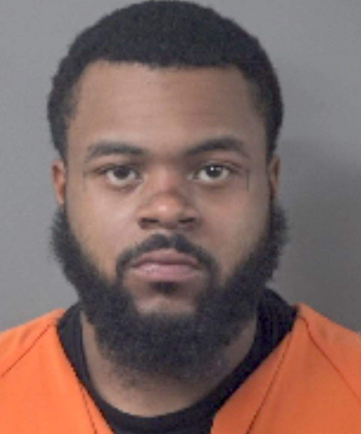 Former employee charged with shooting at business
