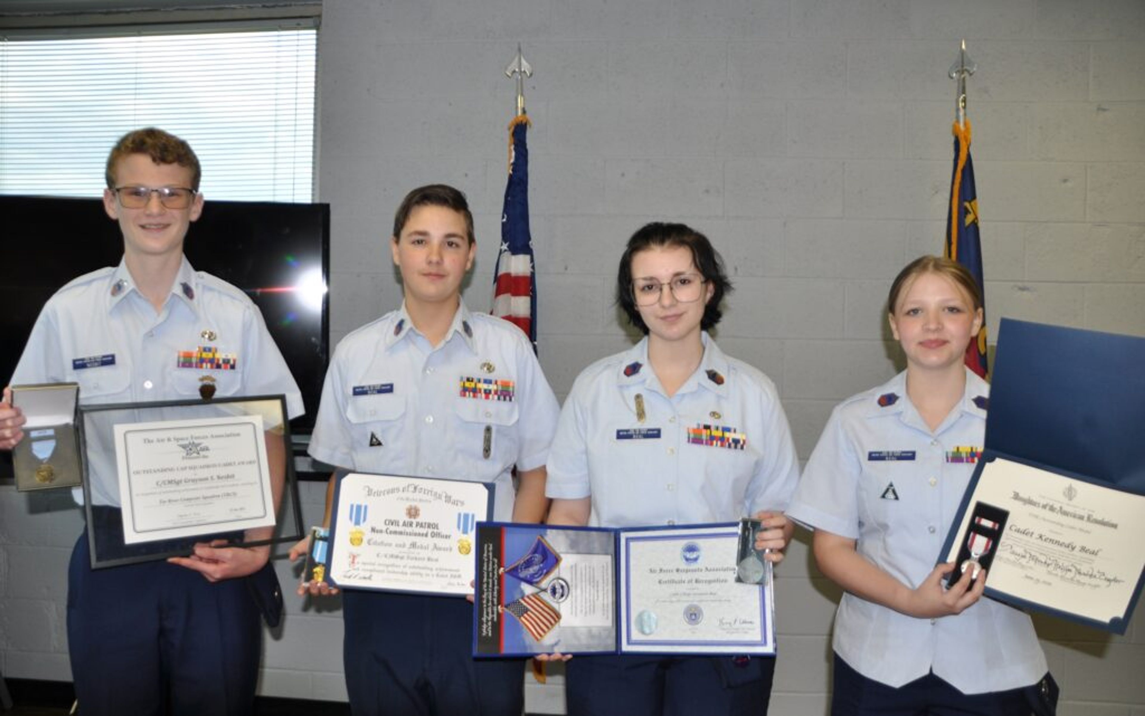 Civil Air Patrol Cadet Chief Master Sgts. Grayson Nesbit, Zach Beal, Savannah Beal and Kennedy Beal are pictured from left with their Cadet of the Year Awards.