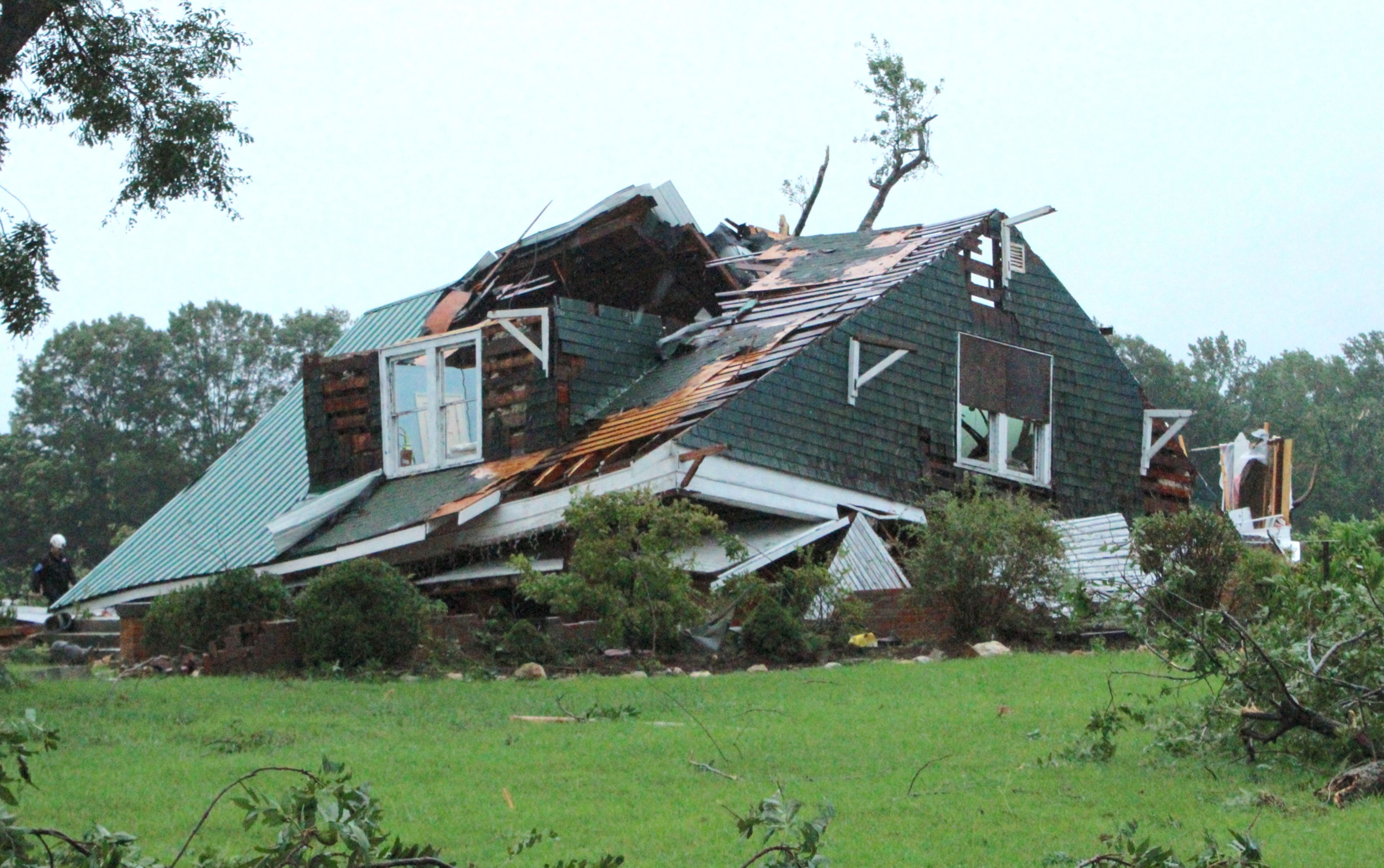 A tornado caused this home on Lloyd Road near Lucama to collapse Thursday morning. Search and rescue teams located a body around 9 a.m. Christopher Long | Times