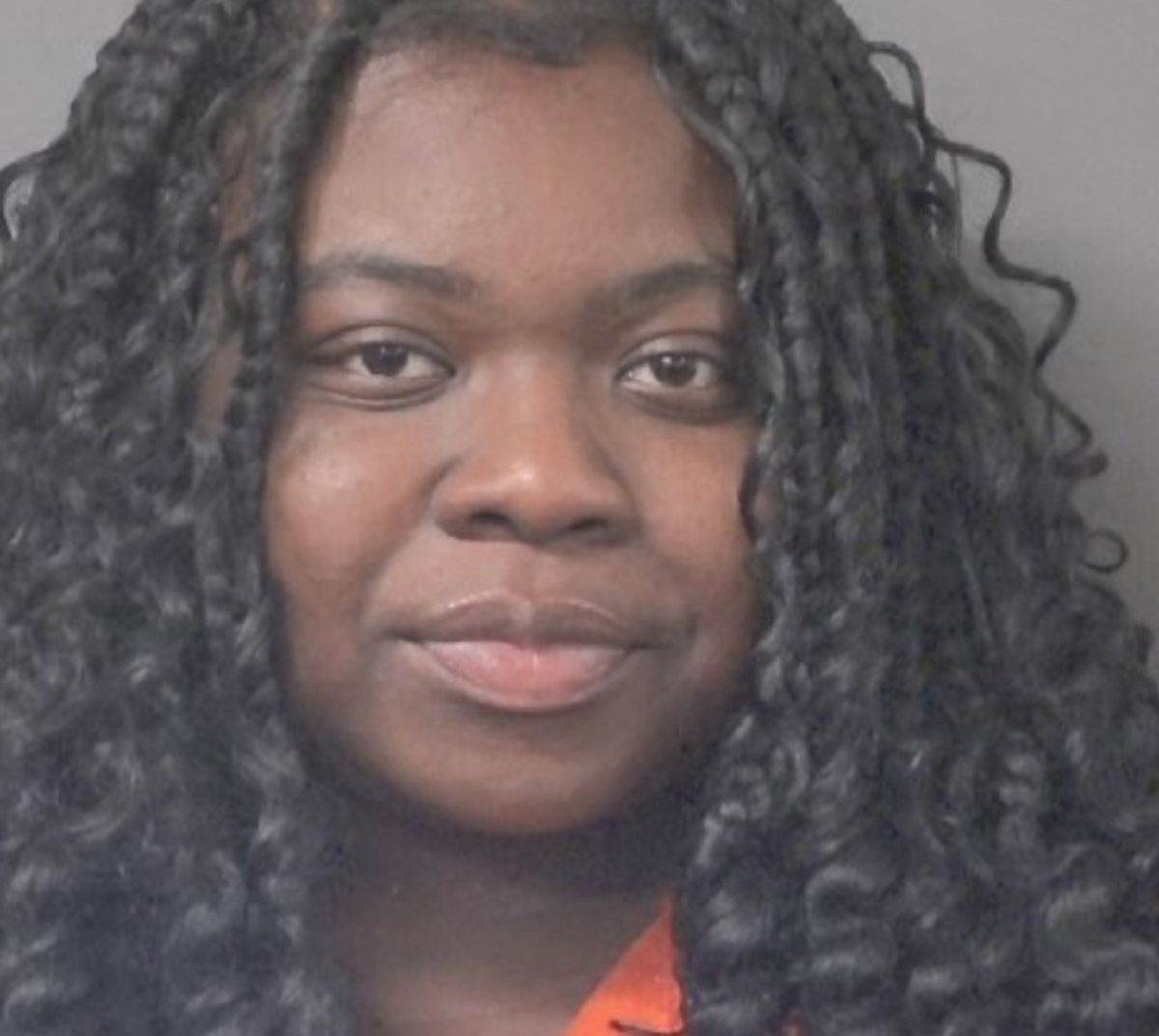 Woman charged with attempted robbery; 2 others sought
