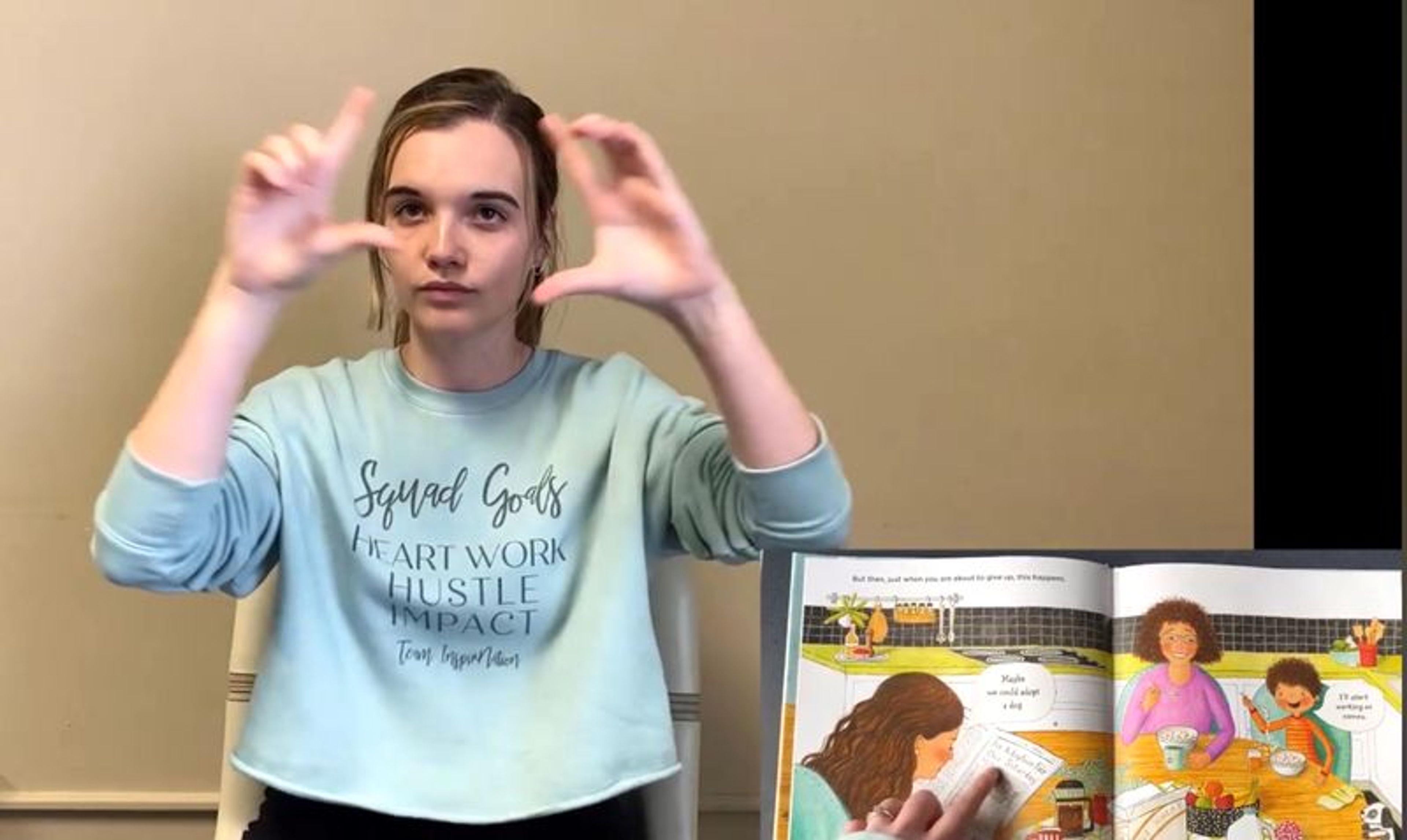 Barton College deaf education student Katelyn Brewer signs the book "Max Explains Everything: Puppy Expert" by Stacy McAnulty for the Wilson County Public Library's Little Hands Storytime. Contributed photo