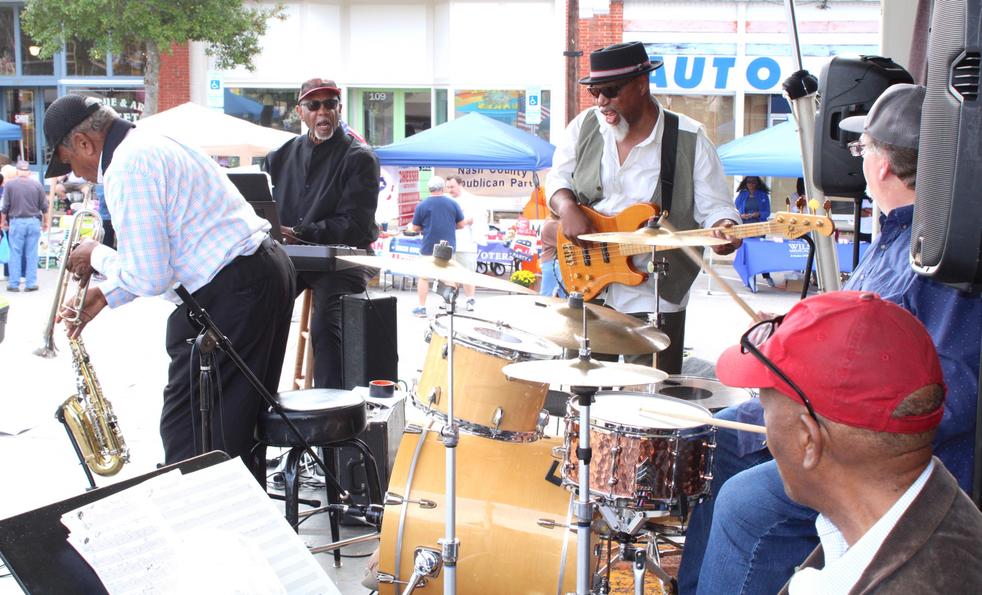 The Monitors, with Dick Knight, from left, Bill Myers, Dale Bryce, drummer Joey Stultz and guitarist Willie Knight, play in Spring Hope on Saturday. Drew C. Wilson | Times