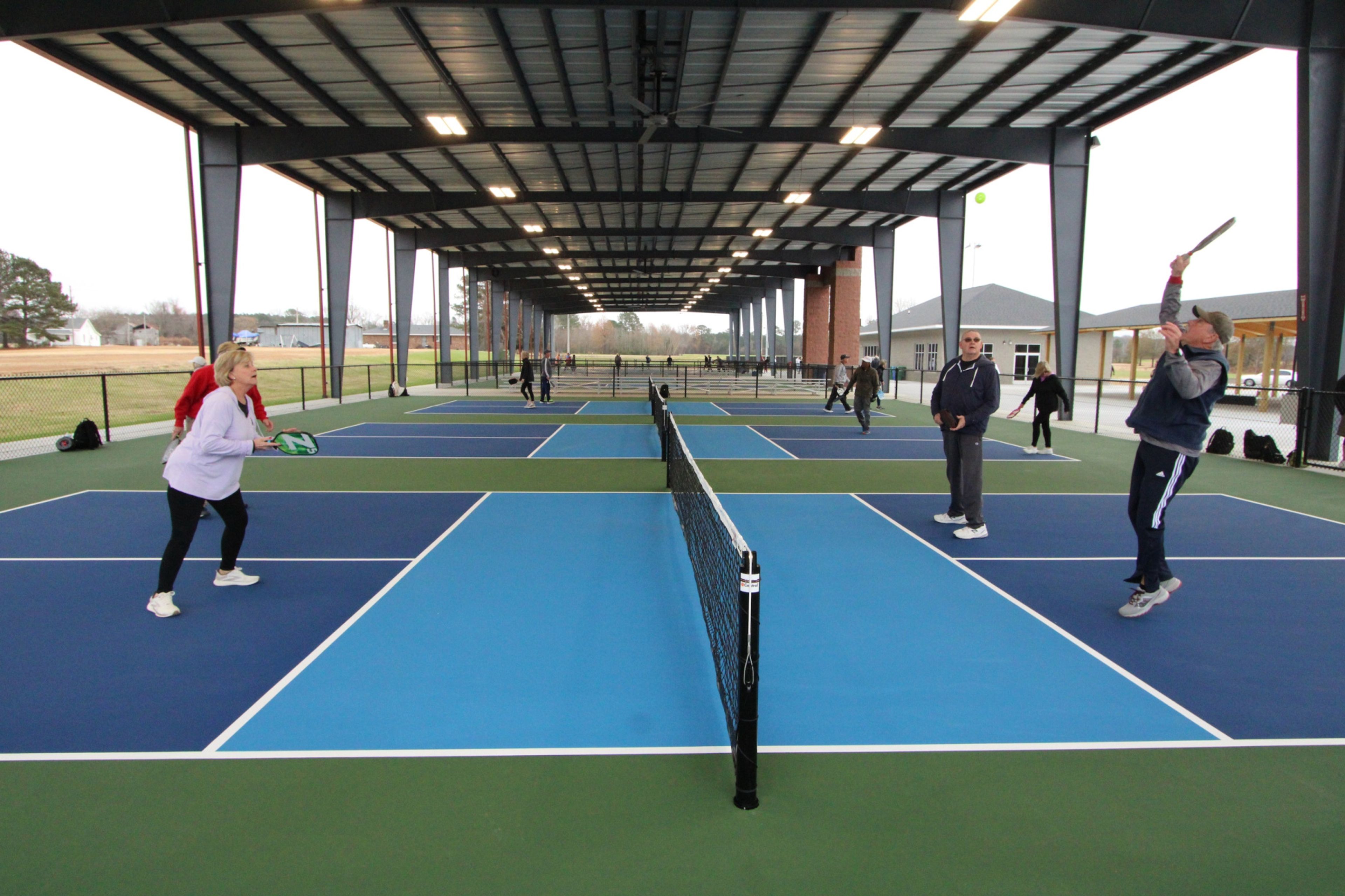 Players try out the new pickleball courts at the J. Burt Gillette Athletic Complex on opening day Monday. Drew C. Wilson | Times