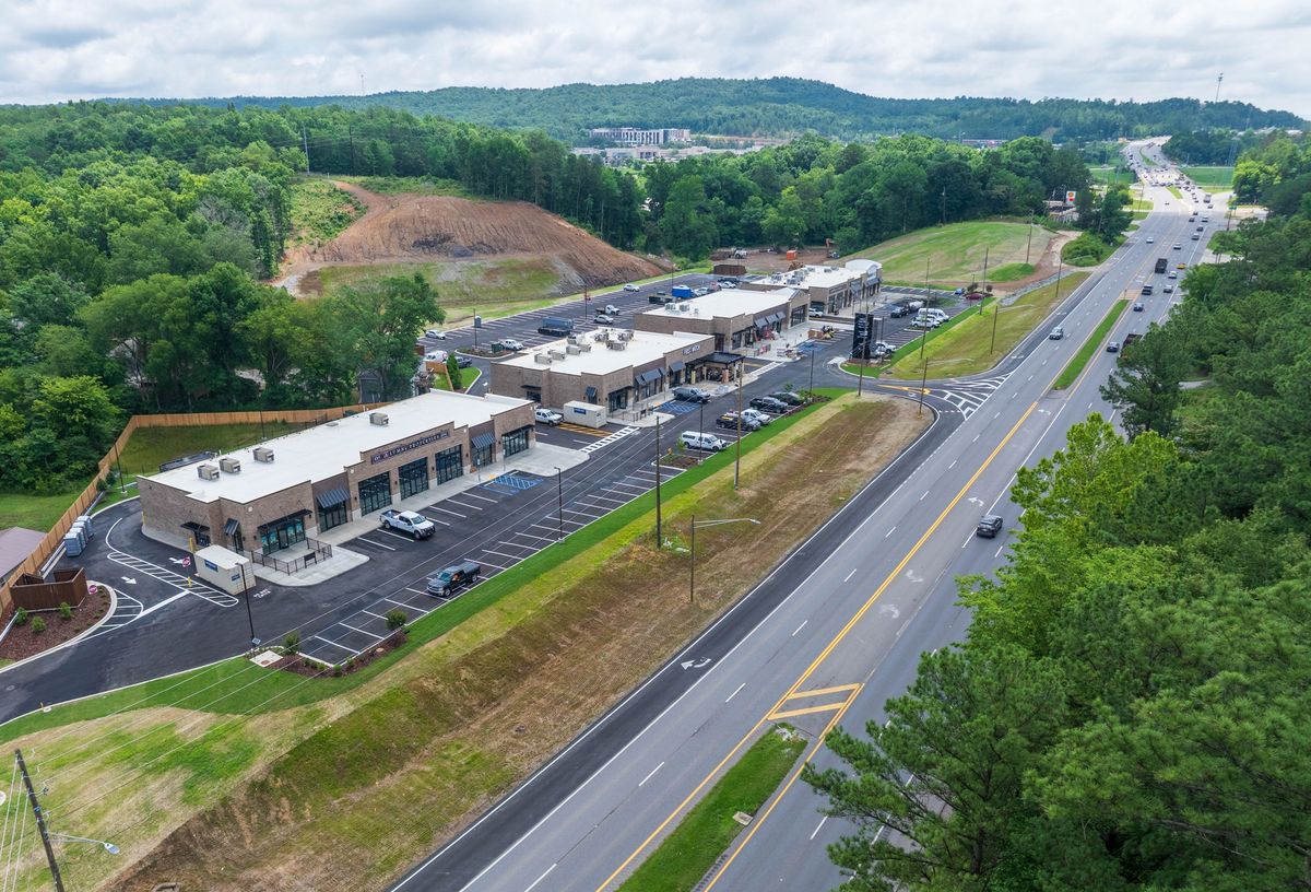 Sign in place at Shoppes at District 31 as development makes...