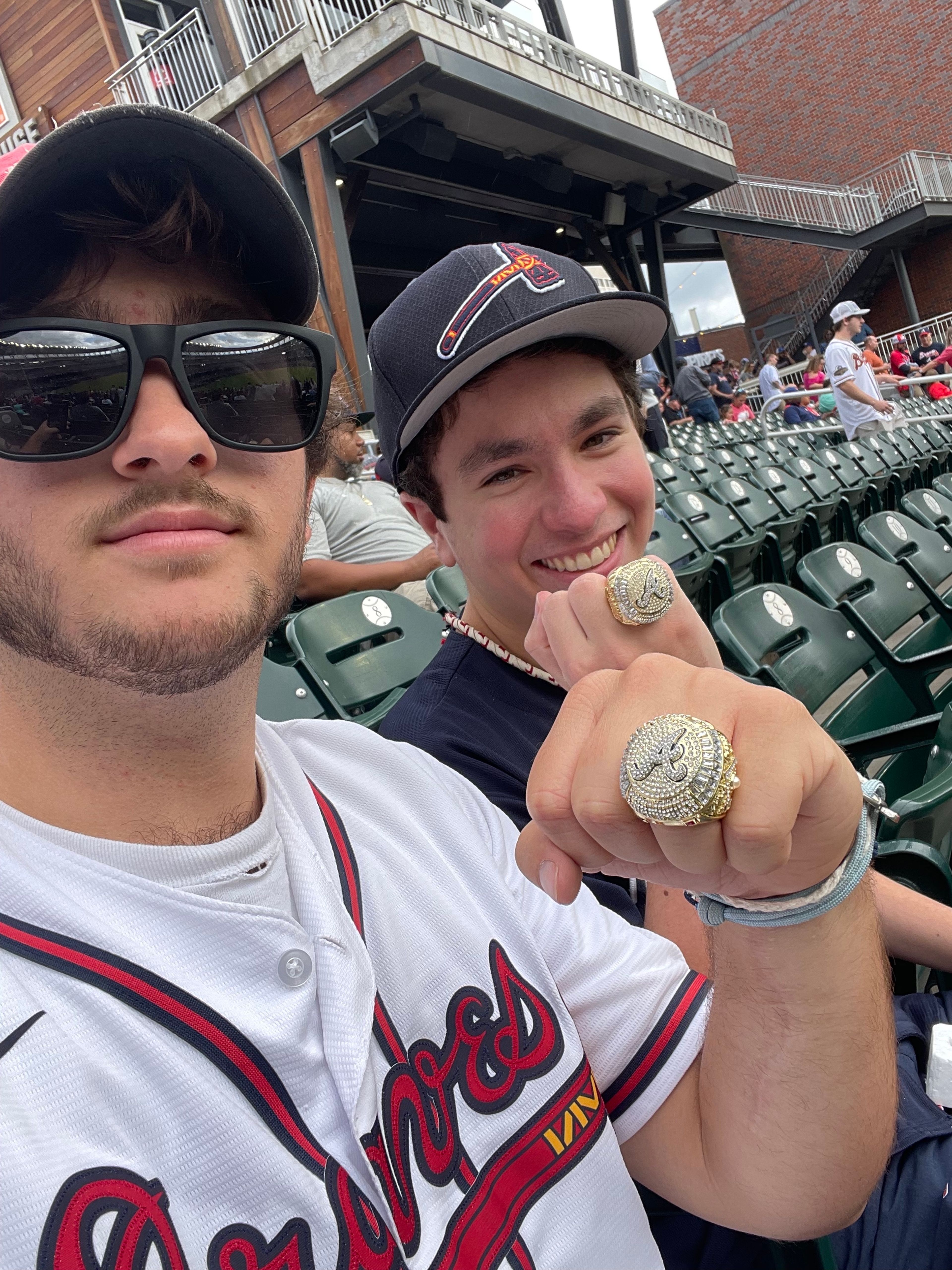My friend and I getting our World Series replica ring at a Braves game in 2022.