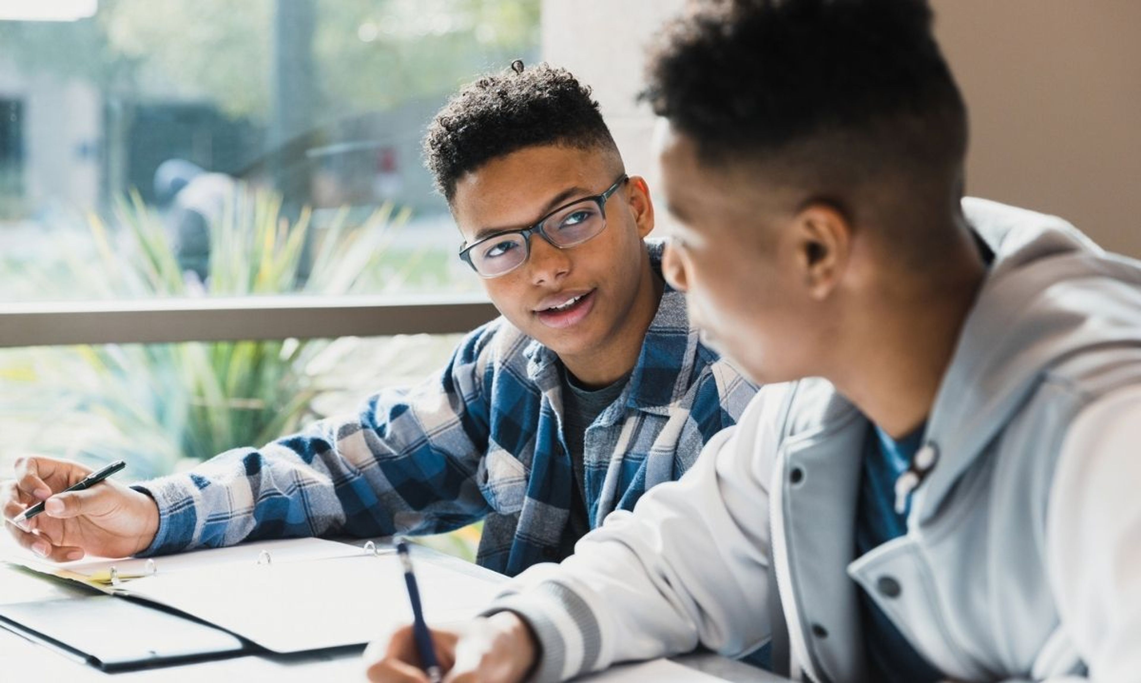 Students study together in Aurora after Indian Prairie School District 204 announces 53 National Merit semifinalists for 2025.