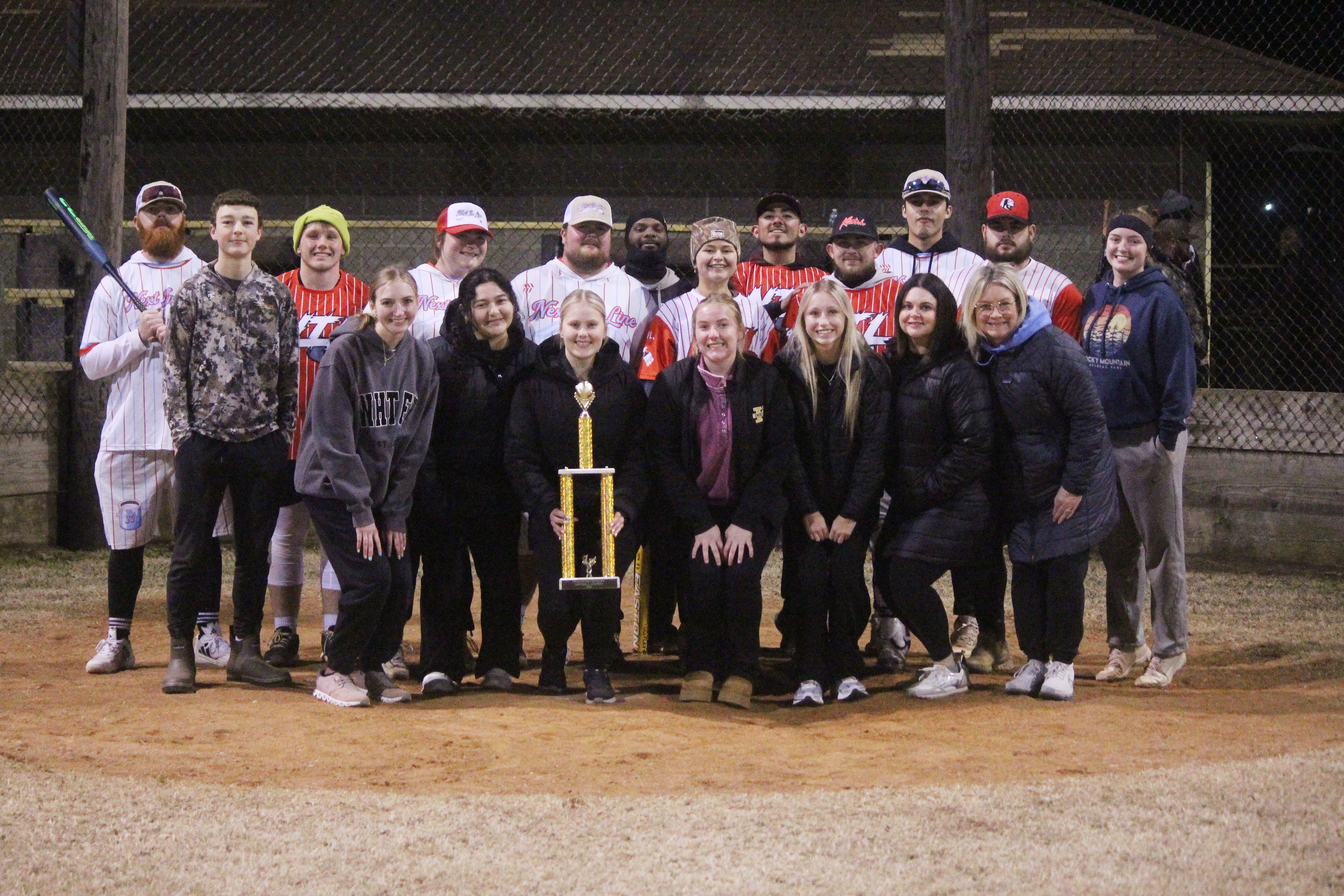Kennett Key Club presents team Next in Line with their first-place trophy after winning the “Striking out Hunger” tournament.