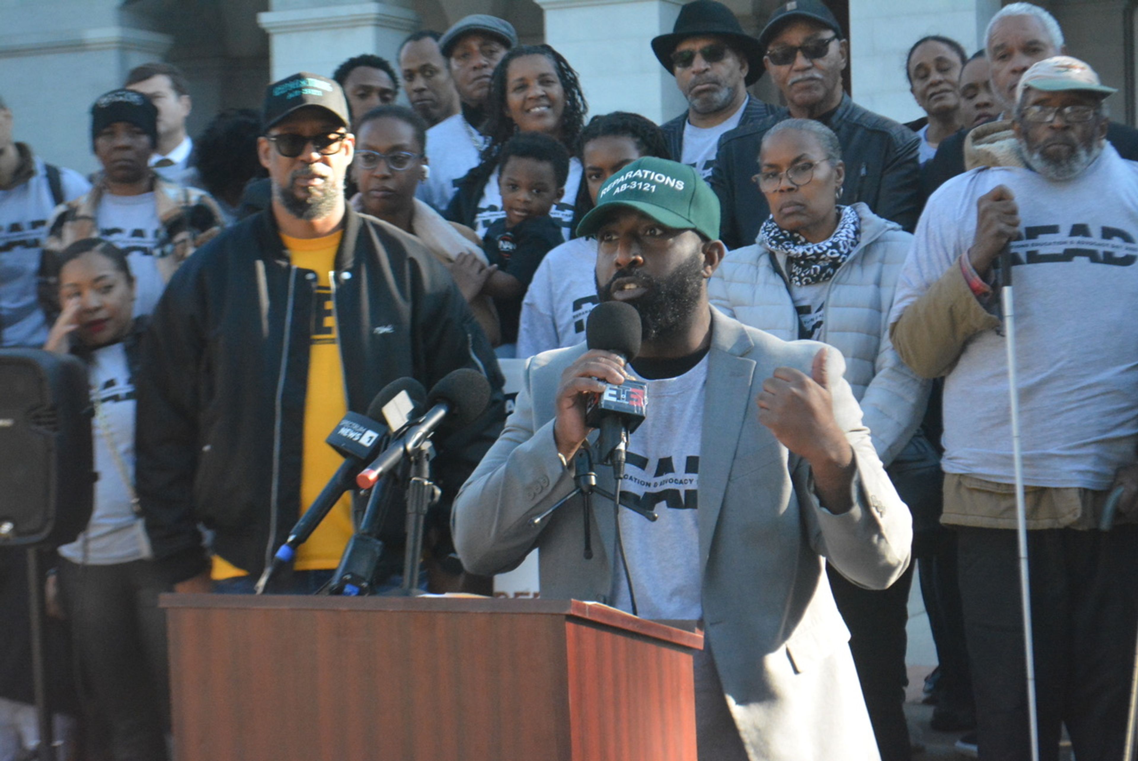 Chris Lodgson, an organizer for CJEC, addresses supporters in front of the California State Capitol, reaffirming their commitment to pursuing reparative justice. CBM photo by Antonio Ray Harvey. Chad Brown leads a group visiting lawmakers' offices at the State Capitol Annex Swing Space to garner support for reparations legislation. Jan. 7. CBM photo by Antonio Ray Harvey. Los Angeles-based attorney Kamilah Moore, Esq., center, joined other supporters of reparations at the State Capitol for Reparations Advocacy Day on Jan. 7. CBM photo by Antonio Ray Harvey.