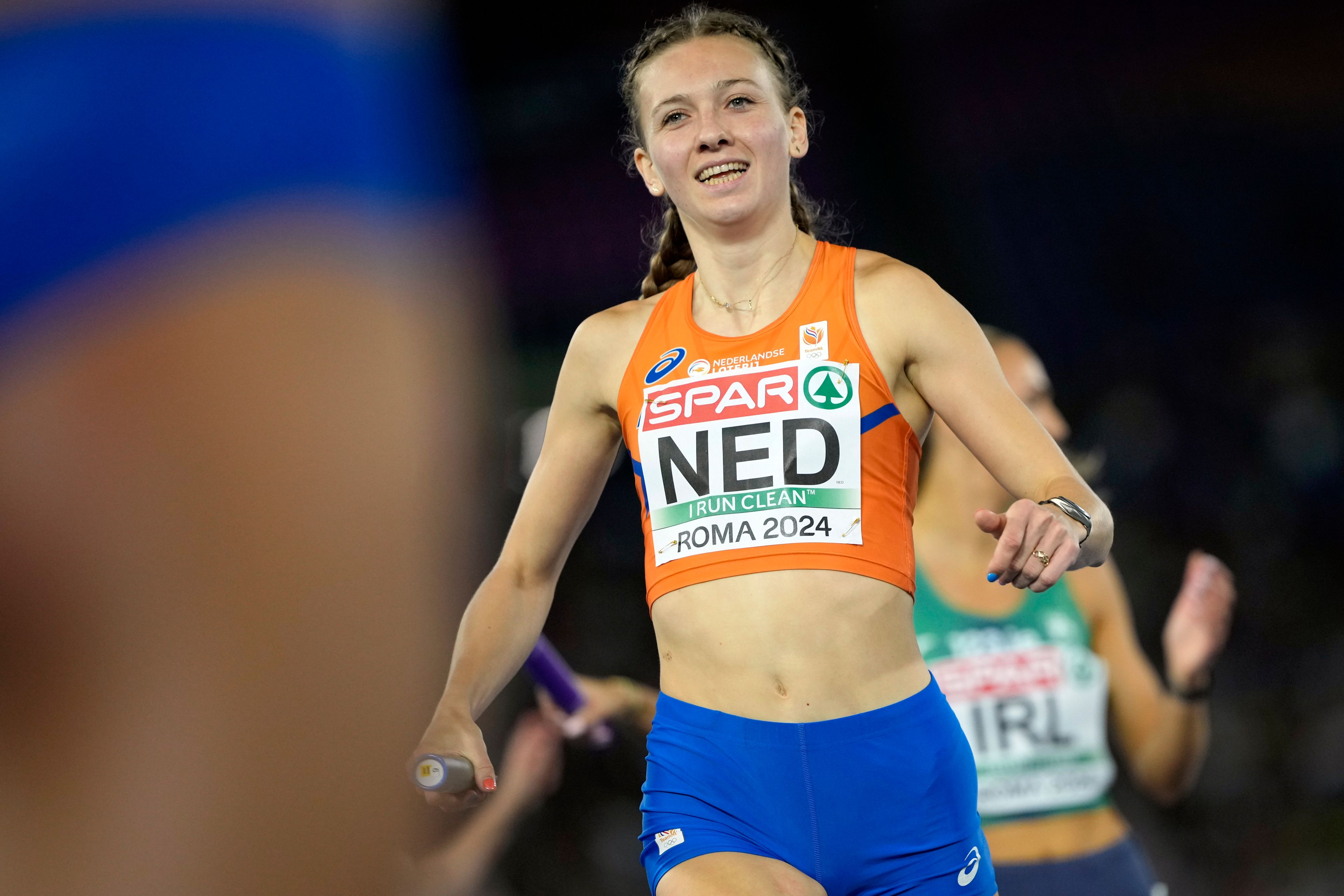 Femke Bol, of the Netherlands, smiles after crossing the finish line to win the gold medal in the women's 4 X 400 meters relay final at the European Athletics Championships in Rome, Wednesday, June 12, 2024. (AP Photo/Stefano Costantino)