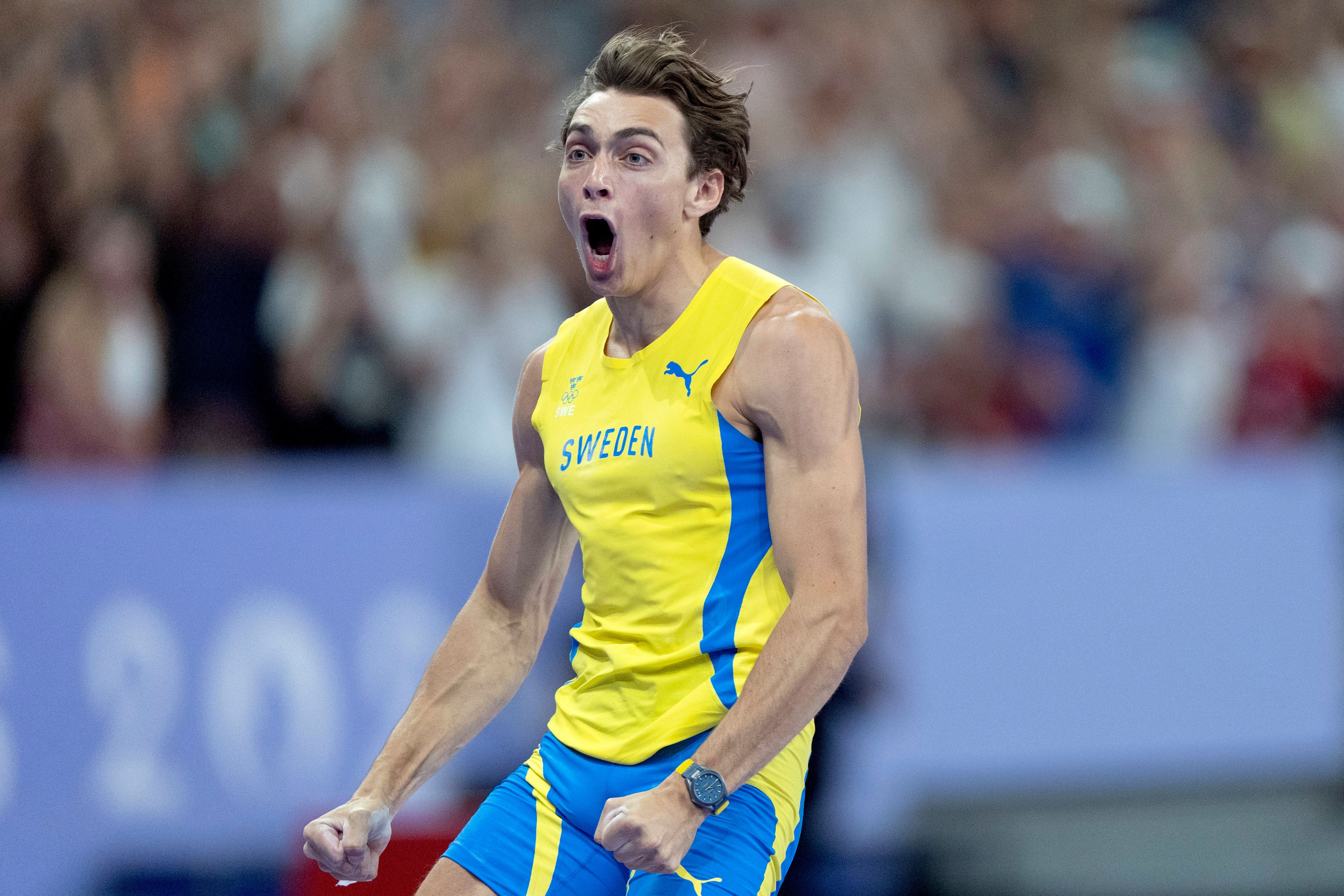 Armand Duplantis, of Sweden, reacts after setting a new world record in the men's pole vault final at the 2024 Summer Olympics, Monday, Aug. 5, 2024, in Saint-Denis, France. (AP Photo/David Goldman)