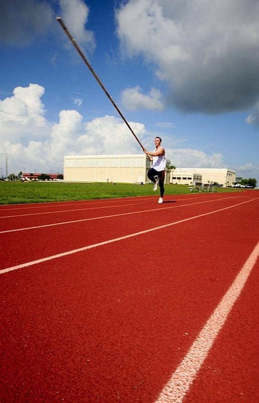 A pole vaulter during his approach run.