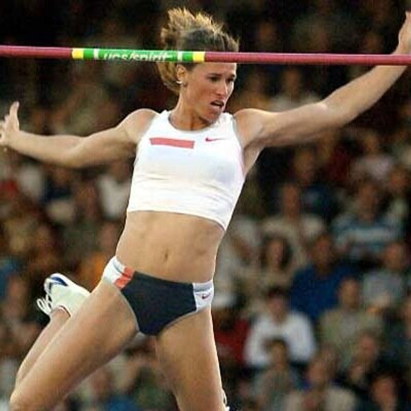 Olympian and current club coach Stacy Dragila in a successful pole vault attempt.