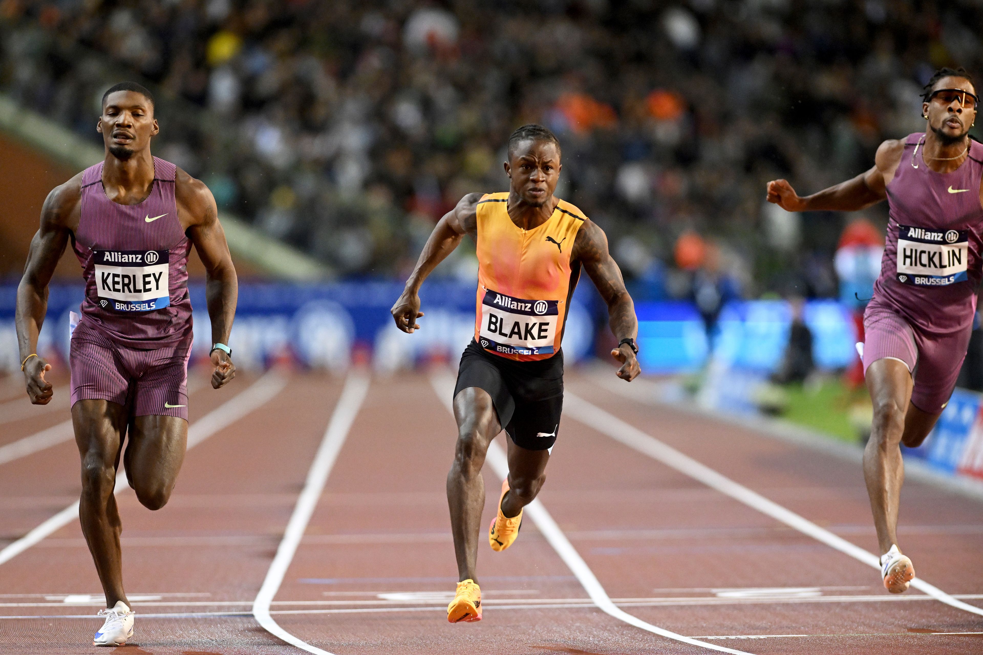 Ackeem Blake, of Jamaica, crosses the finish line to win the men's 100 meters during the Diamond League final 2024 athletics meet in Brussels, Friday, Sept. 13, 2024. (AP Photo/Frederic Sierakowski)