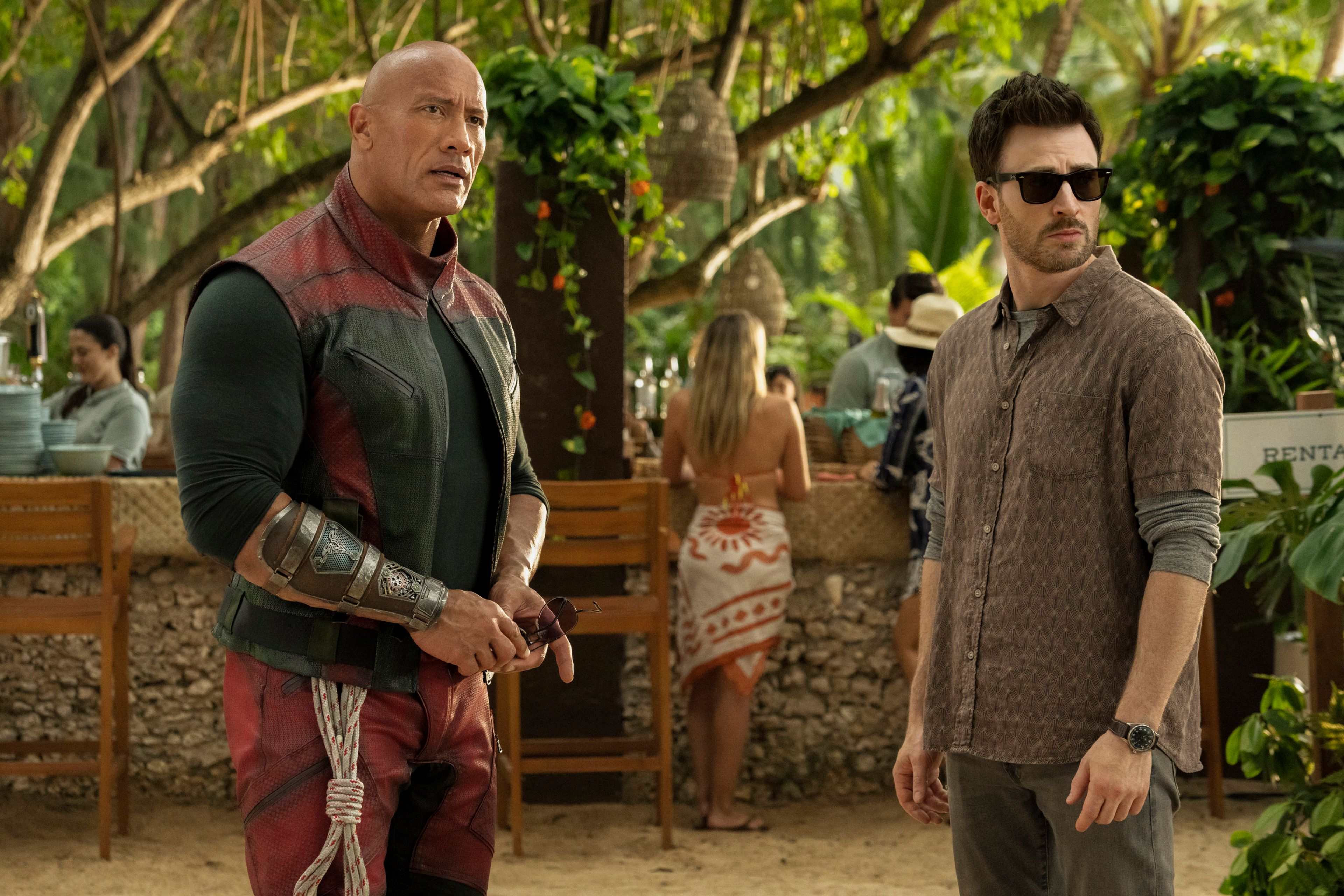 This image released by Prime shows Dwayne Johnson, left, and Chris Evans in a scene from "Red One." 