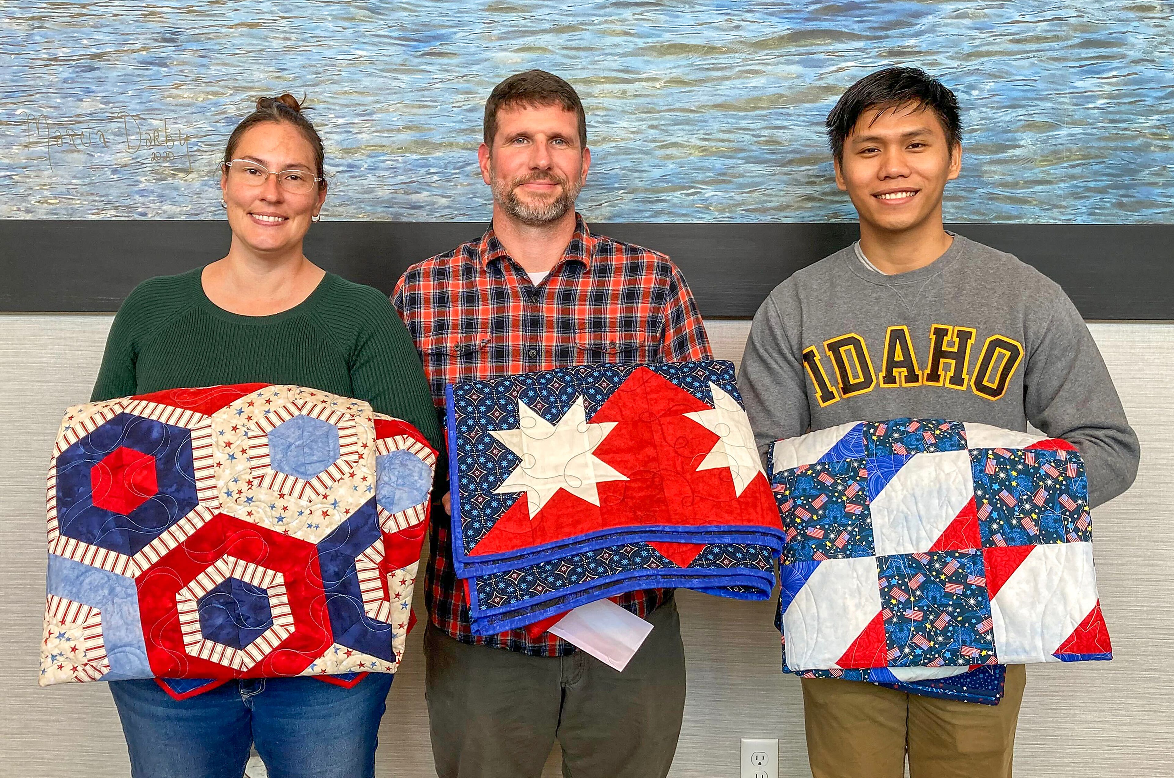 Serena Occhino, from left, Wesley Taylor and Christian Boiser each were awarded a Quilt of Valor on Saturday at the Best Western in Clarkston.
