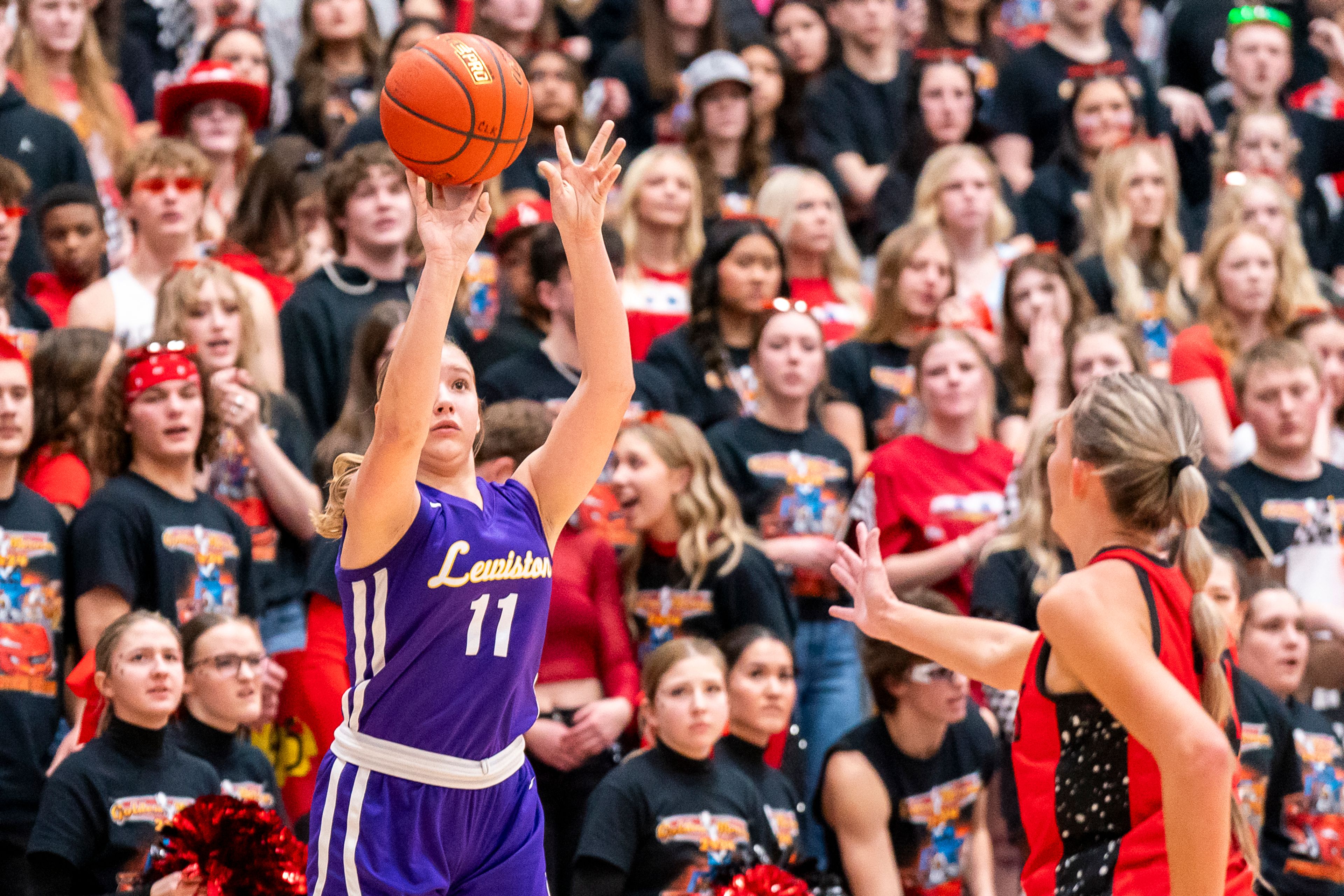 Lewiston’s Emery McKarcher (11) takes a three-point shot during their Golden Throne rivalry game against Clarkston on Friday inside the P1FCU Activity Center in Lewiston.