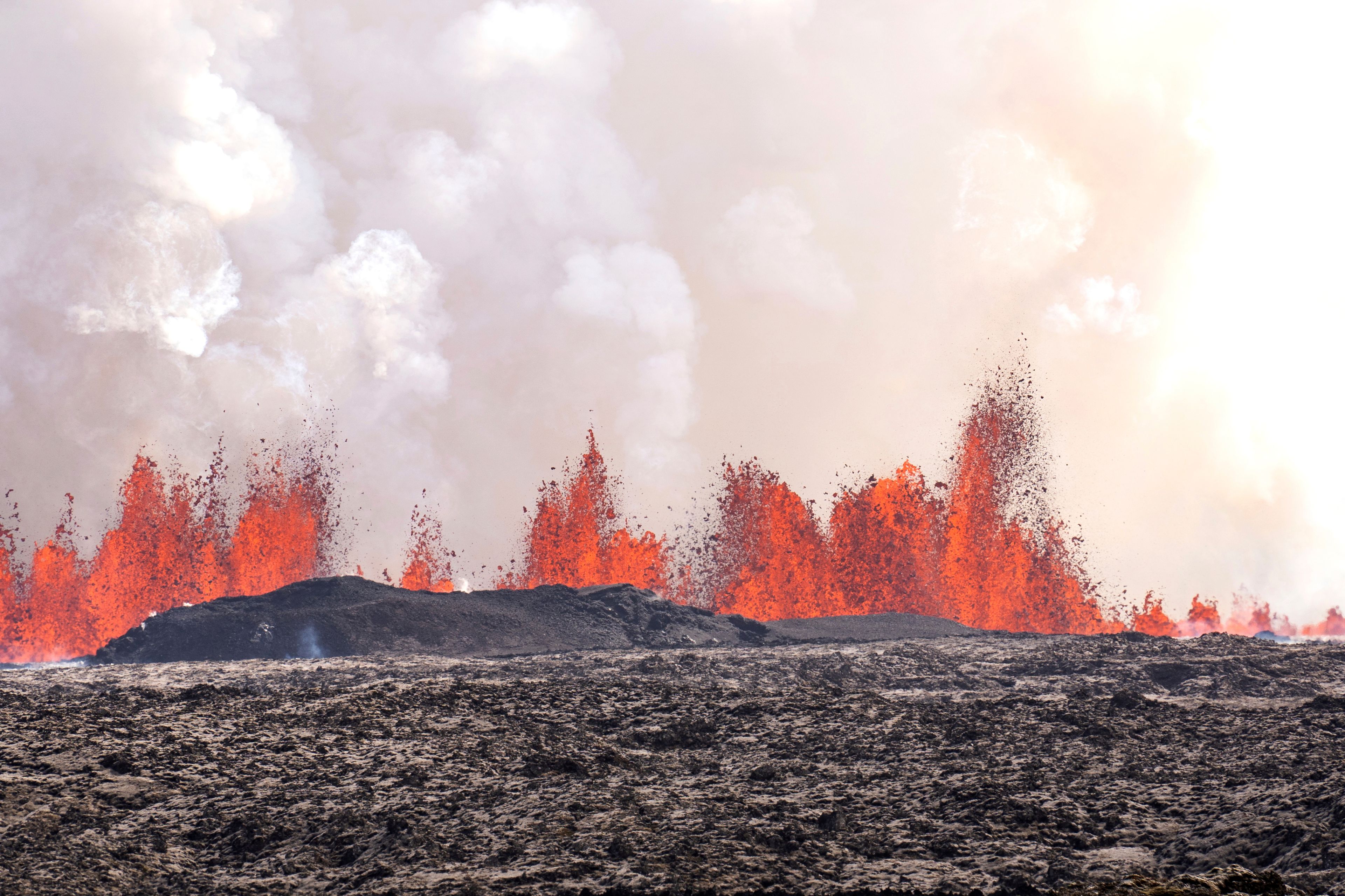 A volcano spews lava in Grindavik, Iceland, Wednesday, Wednesday, May 29, 2024. A volcano in southwestern Iceland is erupting, spewing red streams of lava in its latest display of nature's power. A series of earthquakes before the eruption Wednesday triggered the evacuation of the popular Blue Lagoon geothermal spa. The eruption began in the early afternoon north of Grindavik, a coastal town of 3,800 people that was also evacuated.