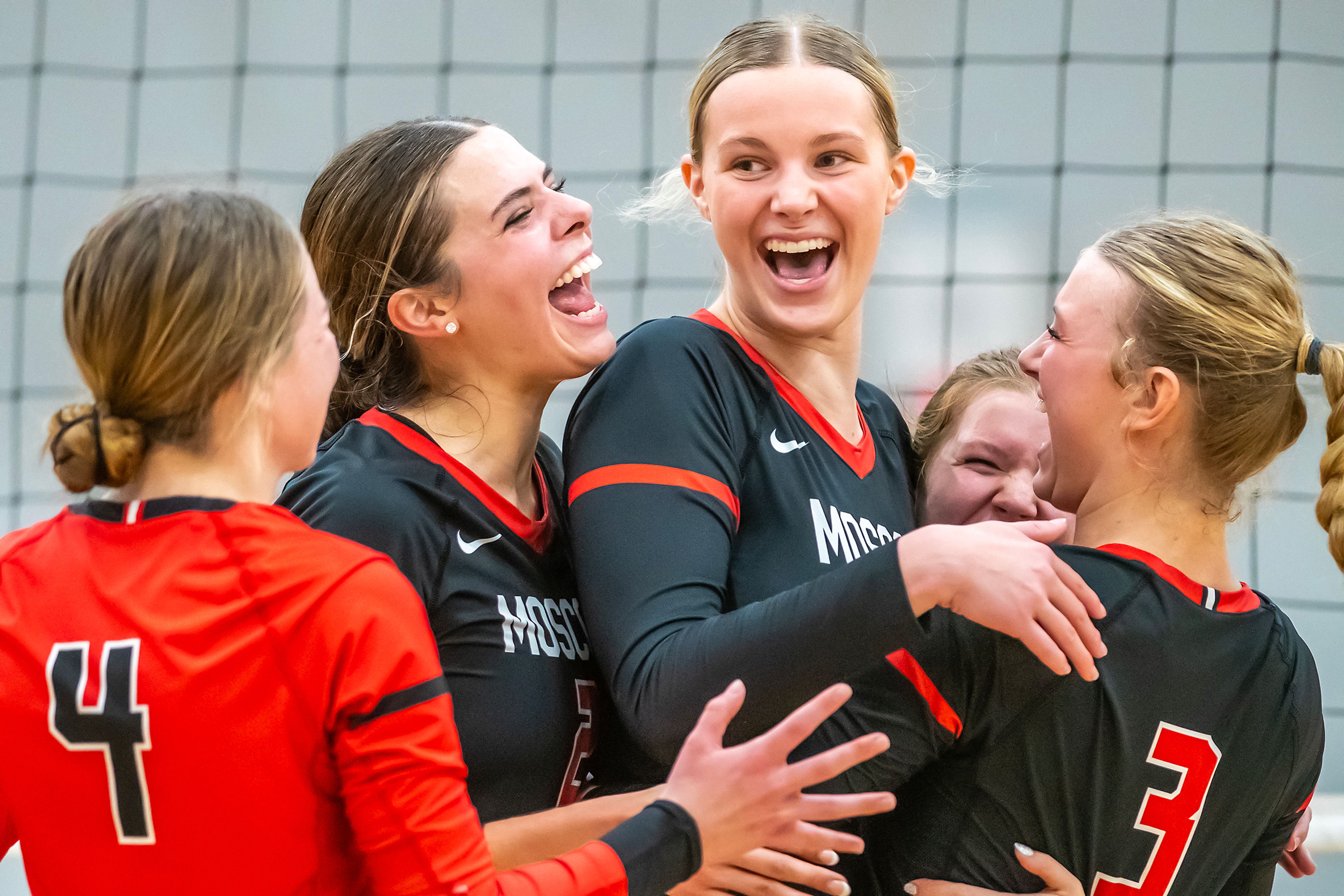 Moscow celebrates winning a set against Lewiston in a 5A district tournament match Tuesday in Lewiston.