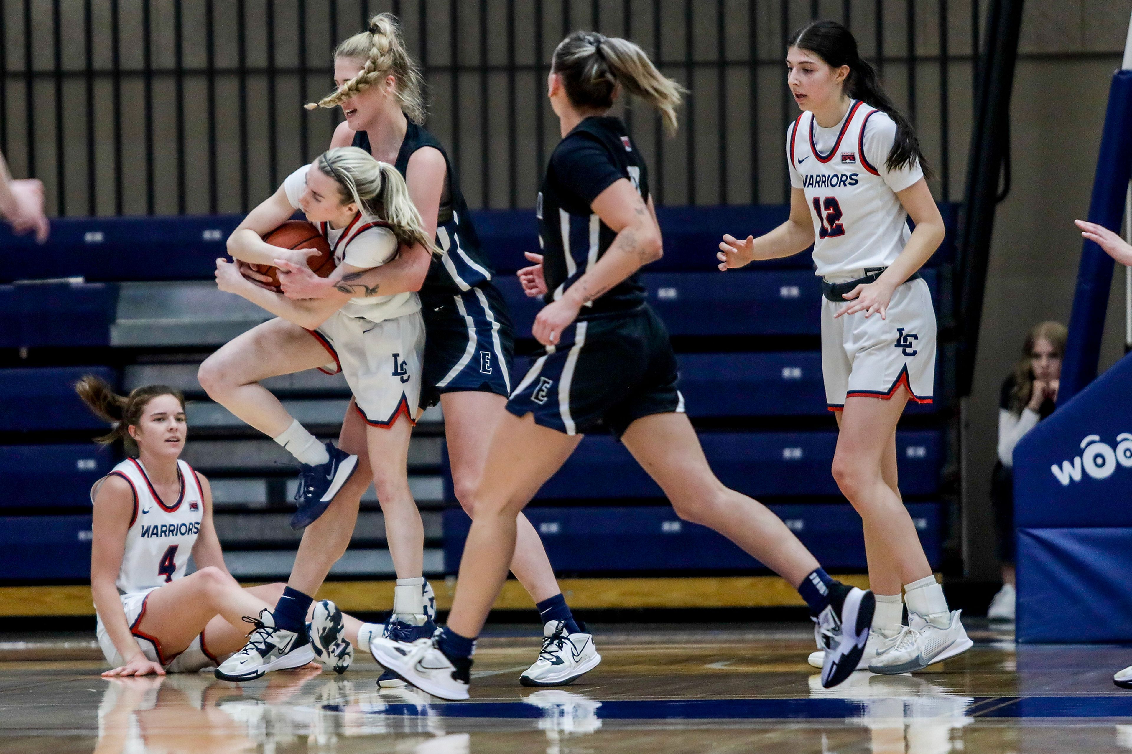 Lewis-Clark State guard Callie Stevens, left, fights to keep the ball away from Eastern Oregon forward Shaelie Burgess during a Cascade Conference game Friday at Lewis-Clark State College.