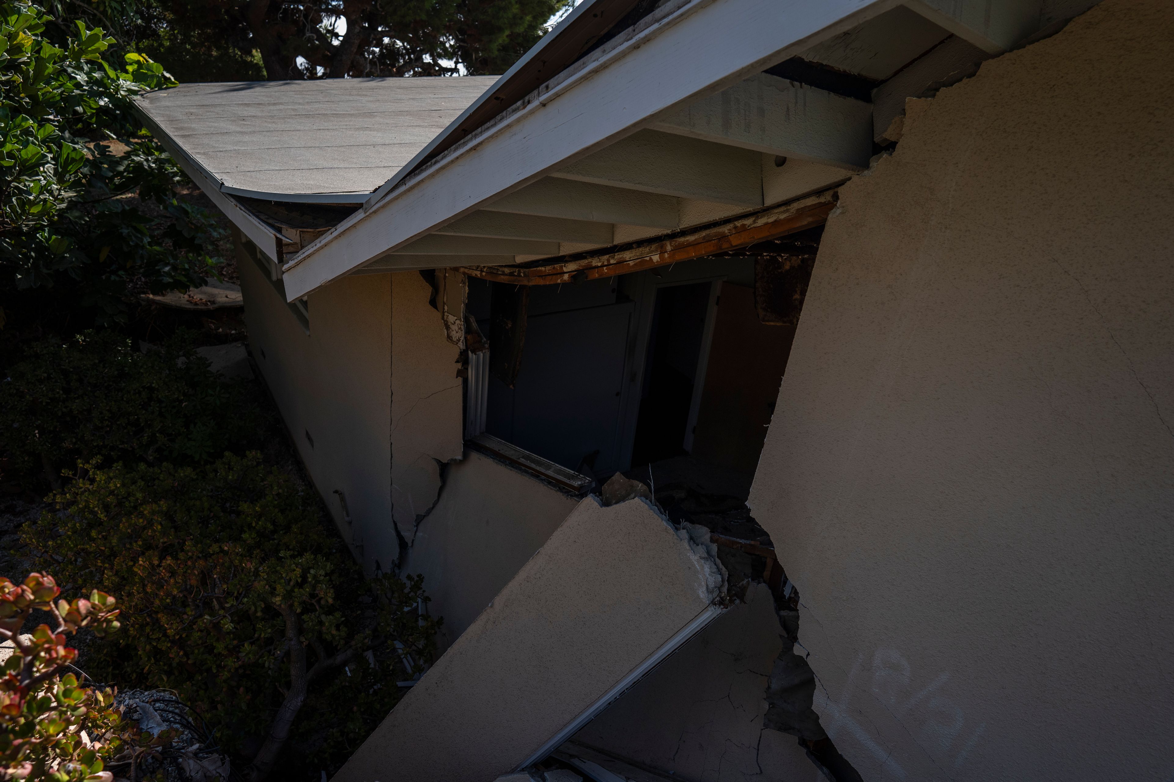 A home severely damaged by ongoing landslides is seen in Rancho Palos Verdes, Calif., Tuesday, Sept. 3, 2024.