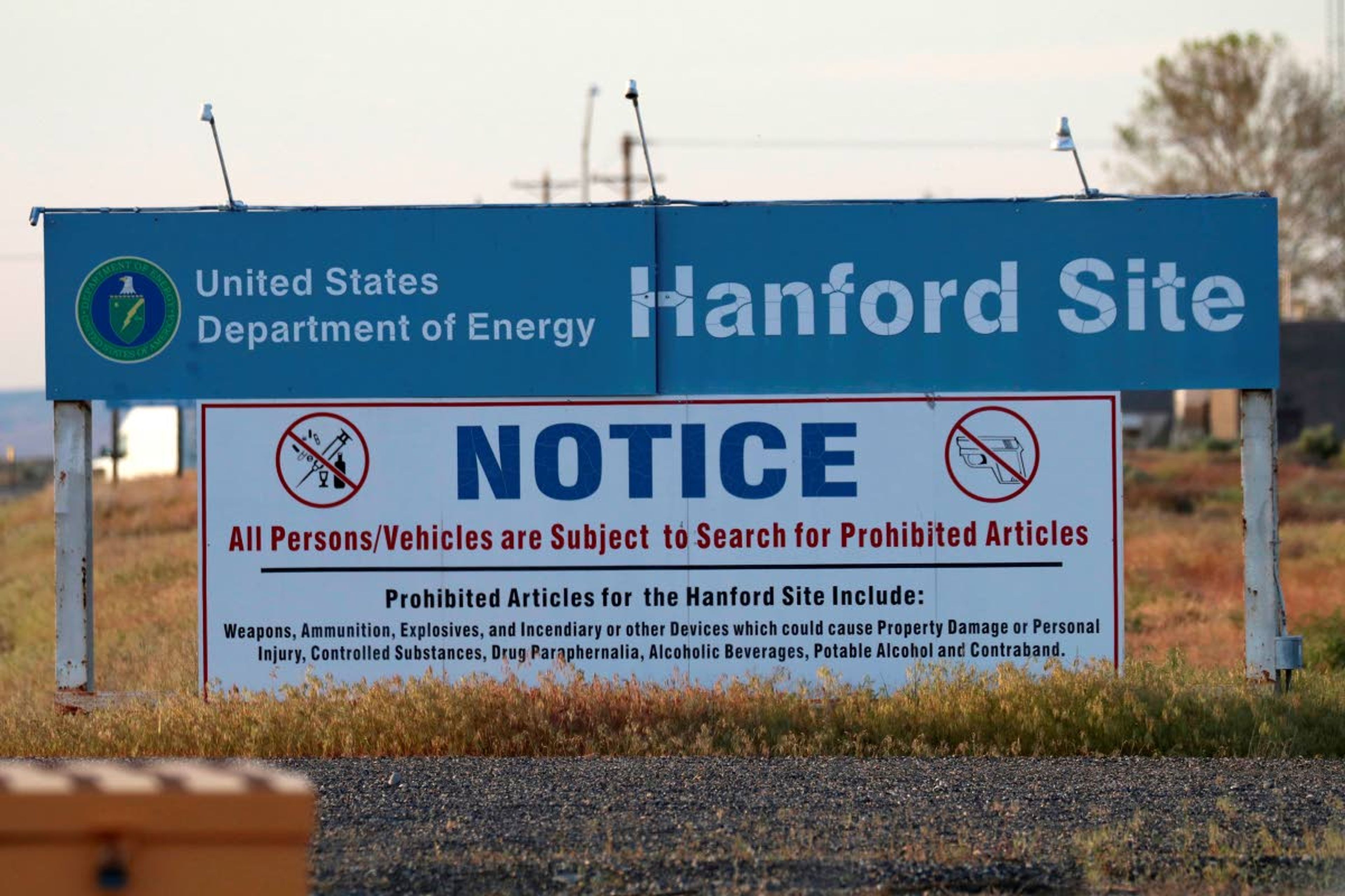 In this May 9, 2017, photo, signs are posted near the entrance to the Hanford Nuclear Reservation in Richland.