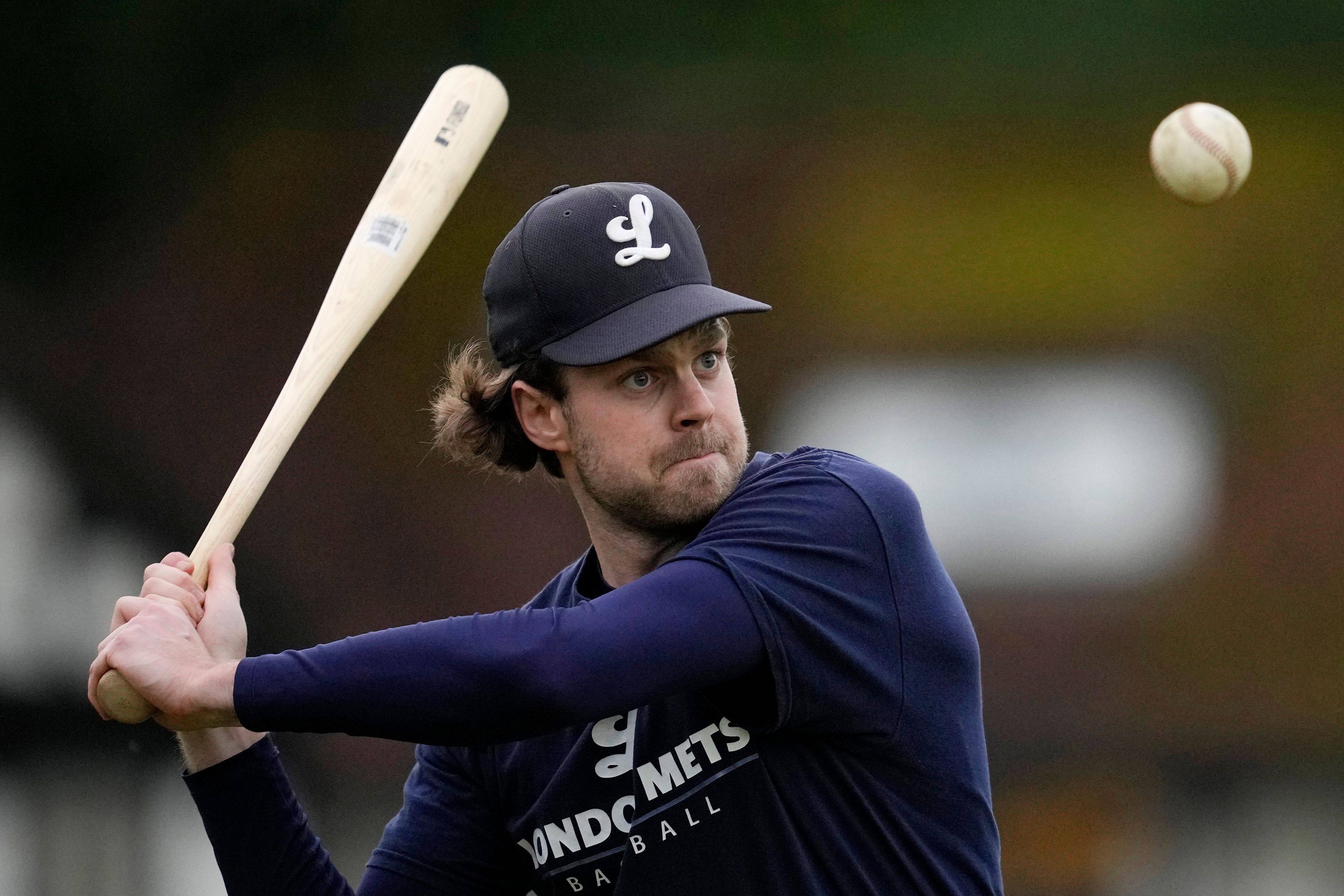 A member of the UK baseball team London Mets practices during a training session at the Finsbury Park in London, Thursday, May 16, 2024. Baseball at the highest club level in Britain is competitive. Teams are mélange of locals and expats some with college and minor league experience.