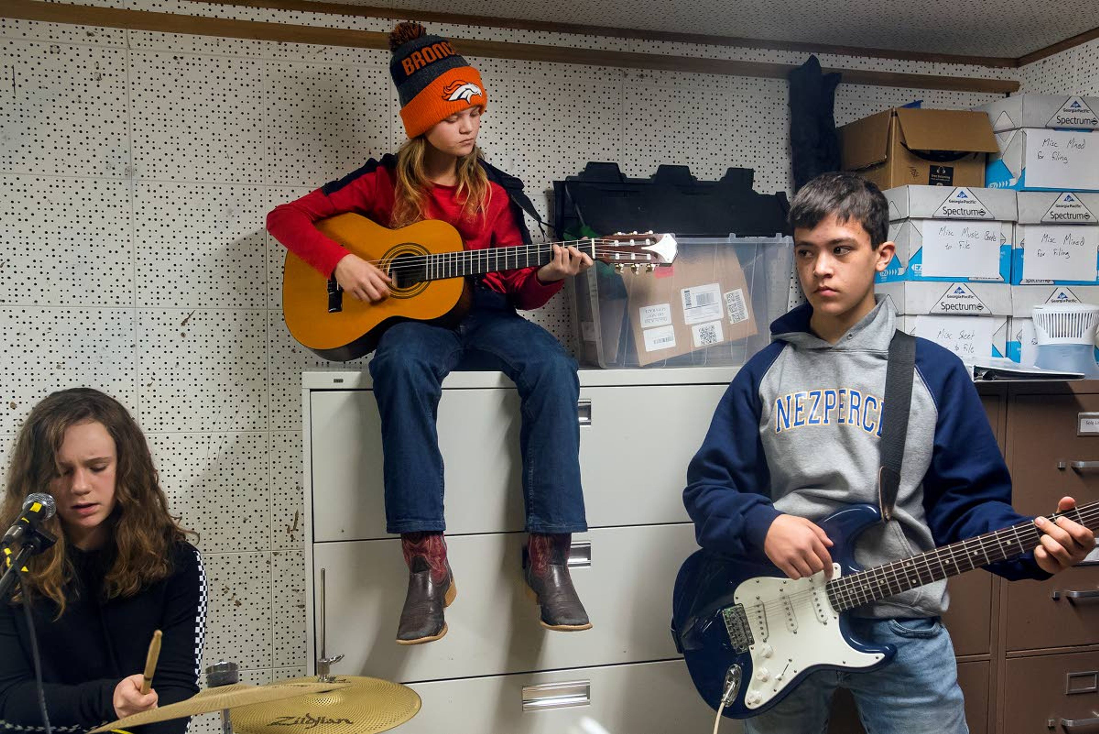 From left, Sierra Hand, Izzy Horton and Justin Meacham play in their country band, "Route 66," during modern band class at Nezperce School on Tuesday in Nezperce.