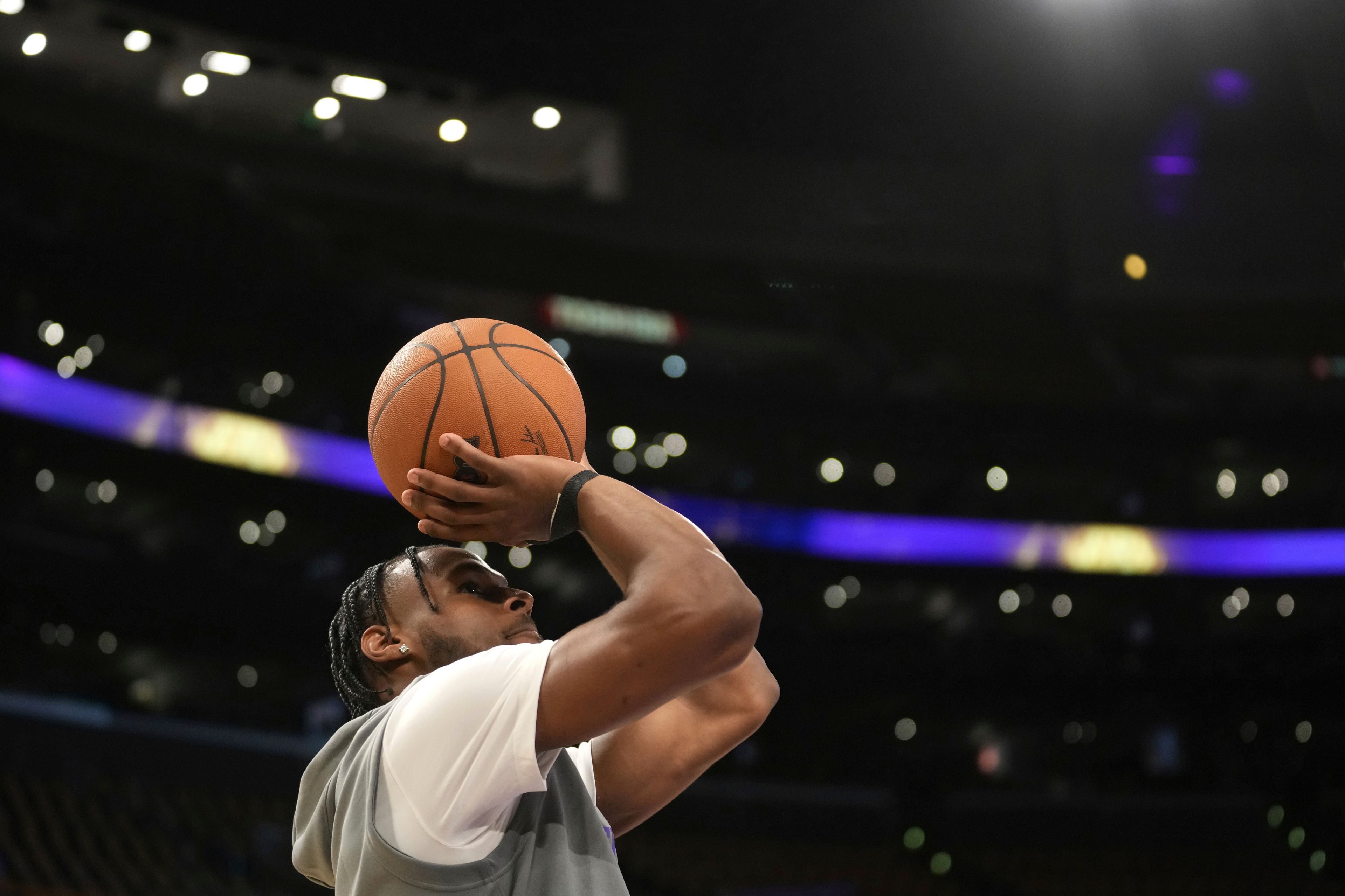 Los Angeles Lakers guard Bronny James warms up before an NBA basketball game against the Minnesota Timberwolves, Tuesday, Oct. 22, 2024, in Los Angeles. (AP Photo/Eric Thayer)