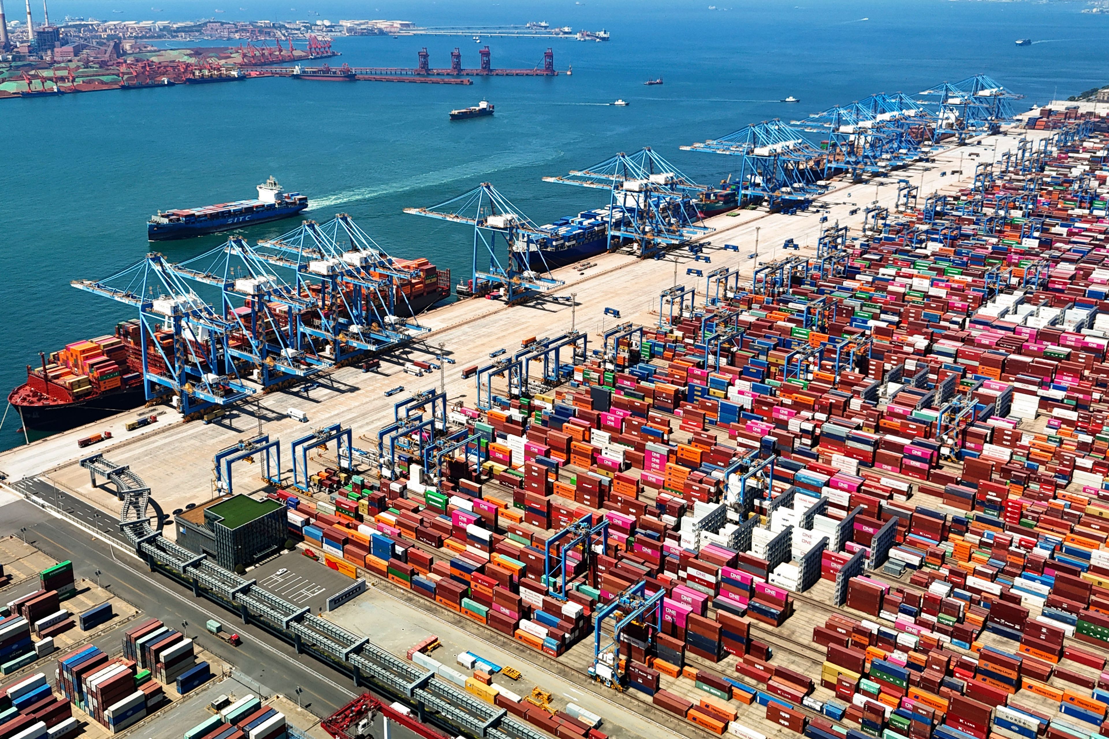 An aerial view of a container port is seen in Qingdao in east China's Shandong province Thursday, June 6, 2024. China's exports for May beat analyst expectations despite trade tensions, though imports shrank based on customs data that was released Friday.