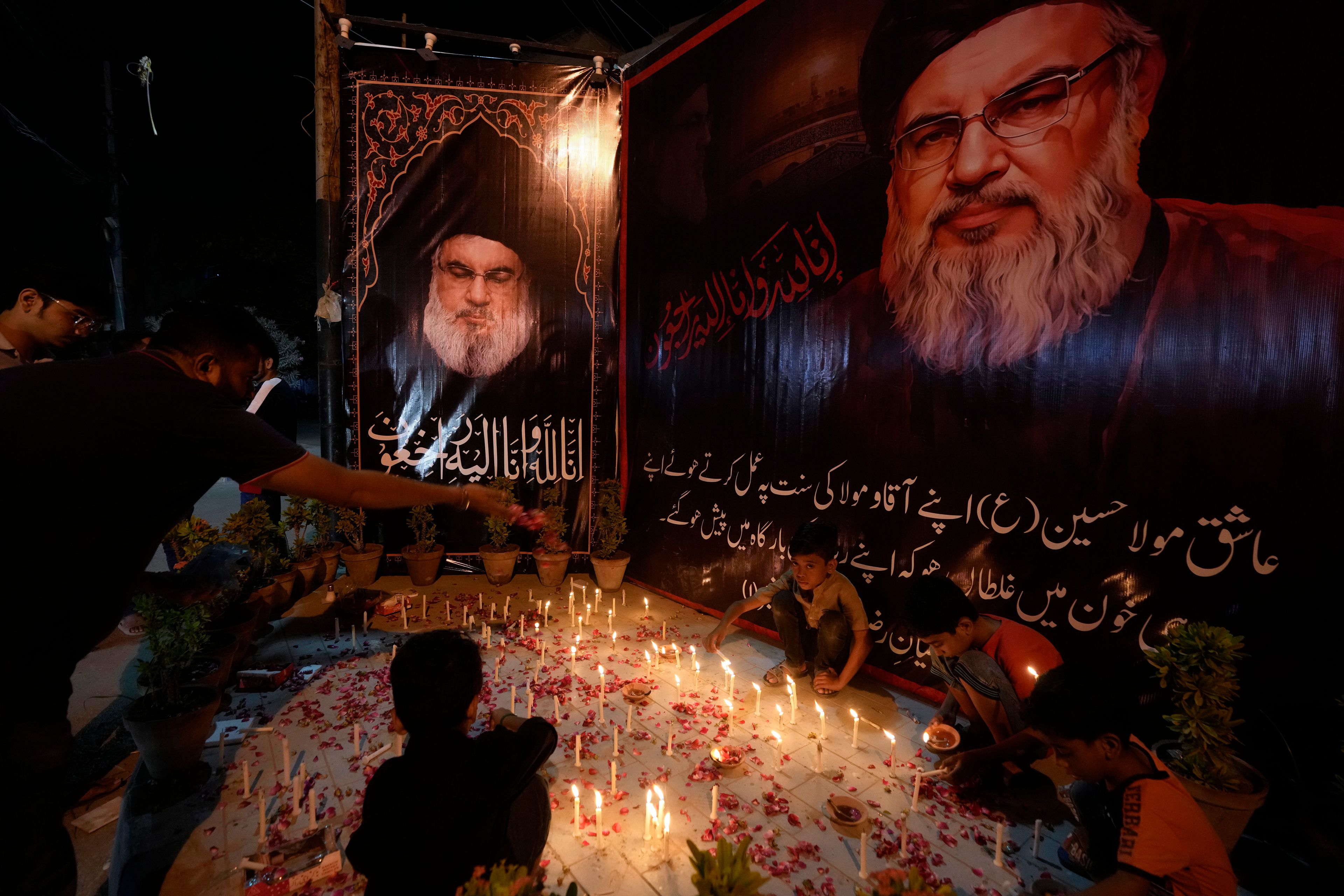 Shiite Muslims light candles during a protest against the killing of Hezbollah leader Hassan Nasrallah, in Karachi, Pakistan, Saturday, Sept. 28, 2024. (AP Photo/Fareed Khan)