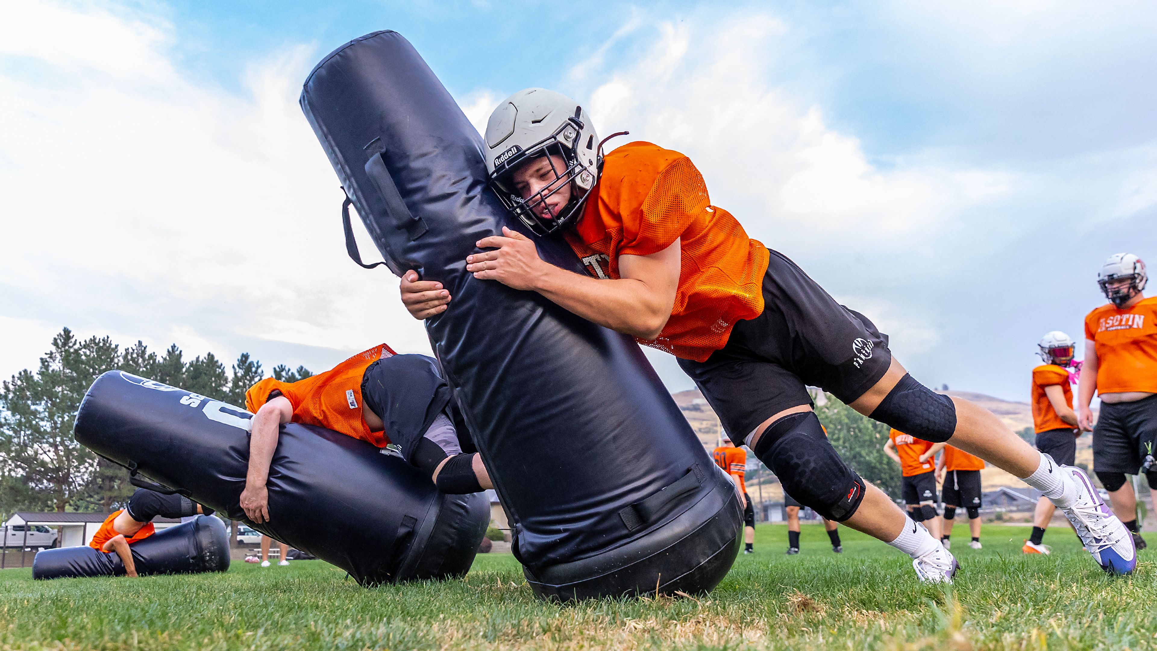 Asotin players work on tackling drills at football practice Monday in Asotin.