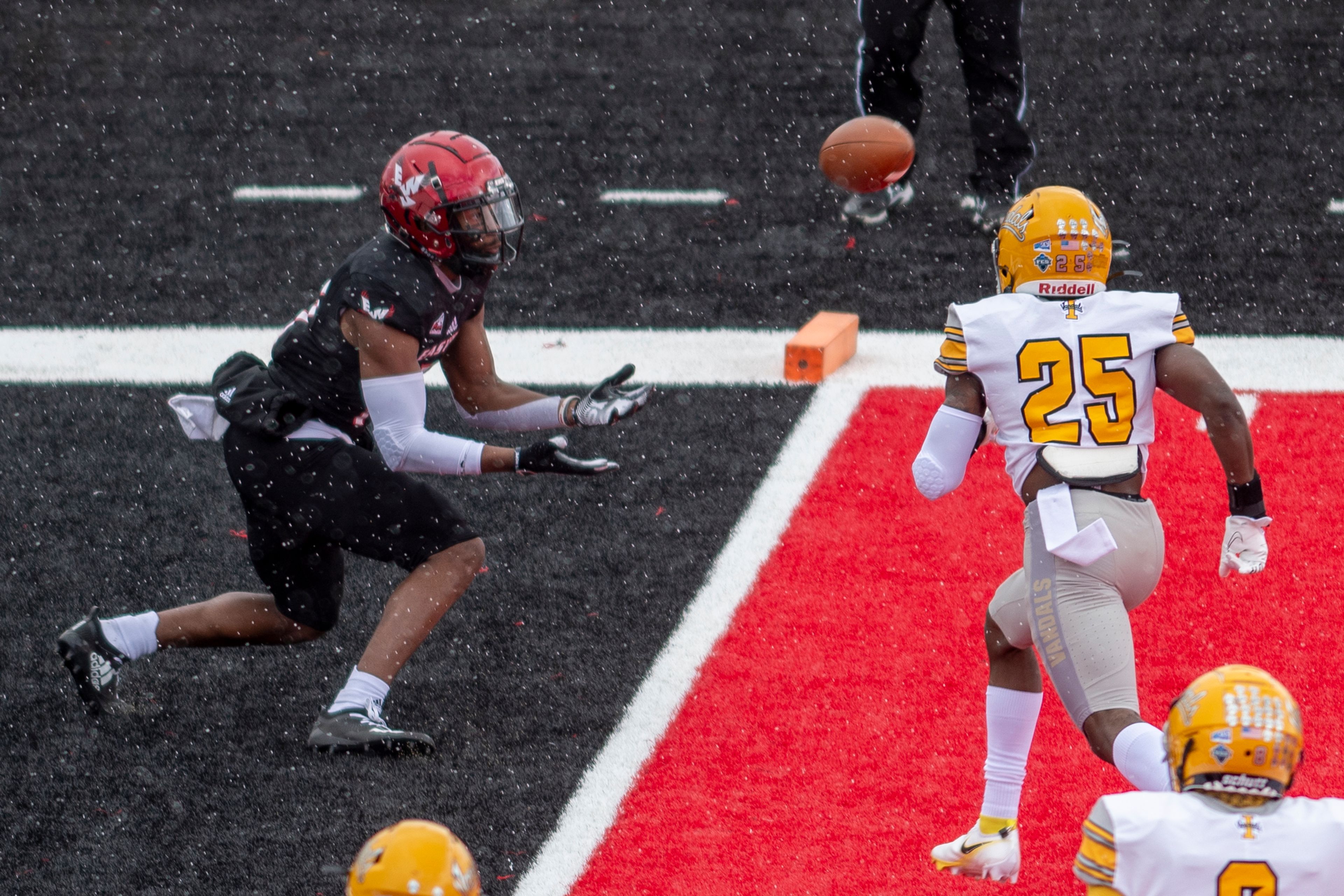 Eastern Washington wide receiver Freddie Roberson (11) brings in a touchdown reception against defensive back Jalen Hoover (25) during the first quarter of a Big Sky Conference matchup at Roos Field on Saturday afternoon. Eastern Washington defeated Idaho 38-31.