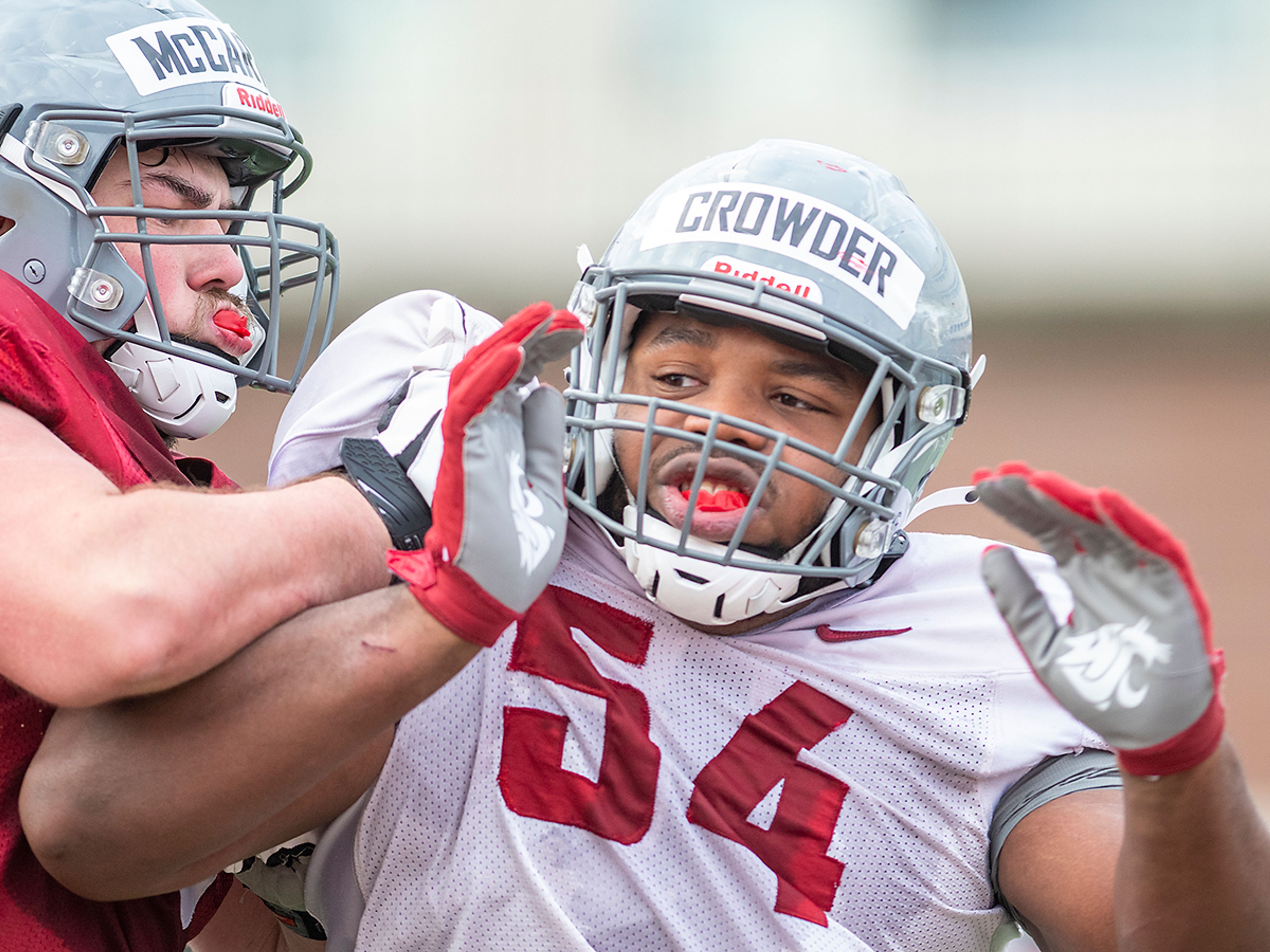 Washington State offensive lineman Quinn McCarthy (60) blocks defensive tackle Ahmir Crowder (54) during a practice at Rogers Field in Pullman.